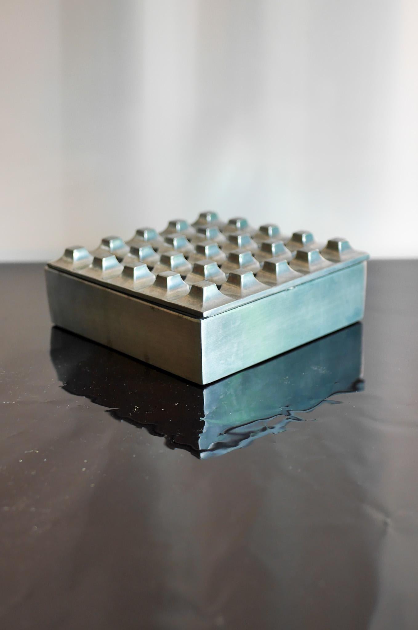  An iconic white metal brutalist sculptural ashtray, design by Holger Bäckström and Bo Ljungberg known as Ultima 15 made by Diverse Ting, Malmö, Sweden in the mid-1970s. These ashtrays are very decorative and recalls of a bygone era when smoking was