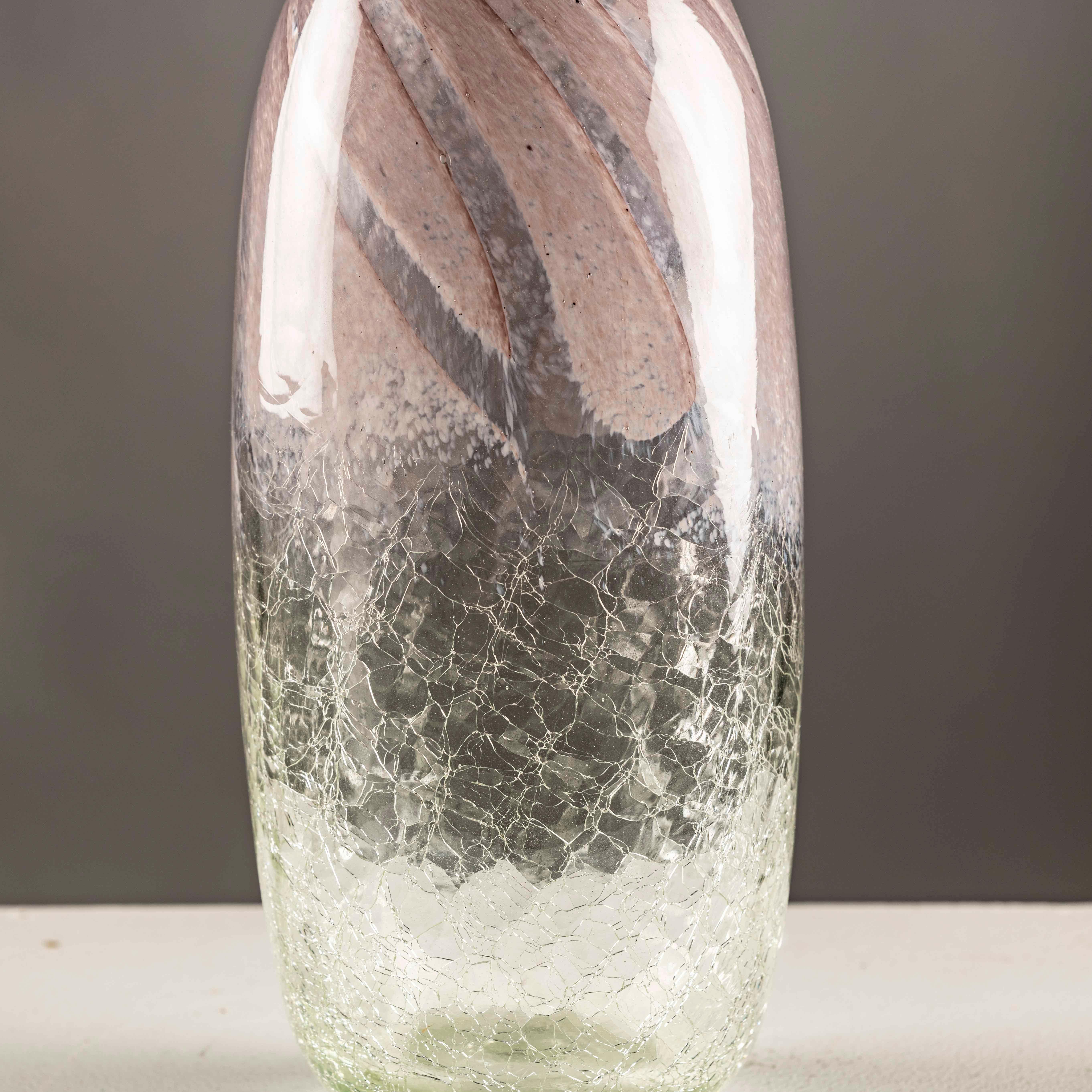 The Mid-century Scandinavian Craquele glass vase epitomizes the timeless allure of Scandinavian design, offering a perfect blend of form and function. Crafted with precision and attention to detail, this exquisite vase exudes elegance and