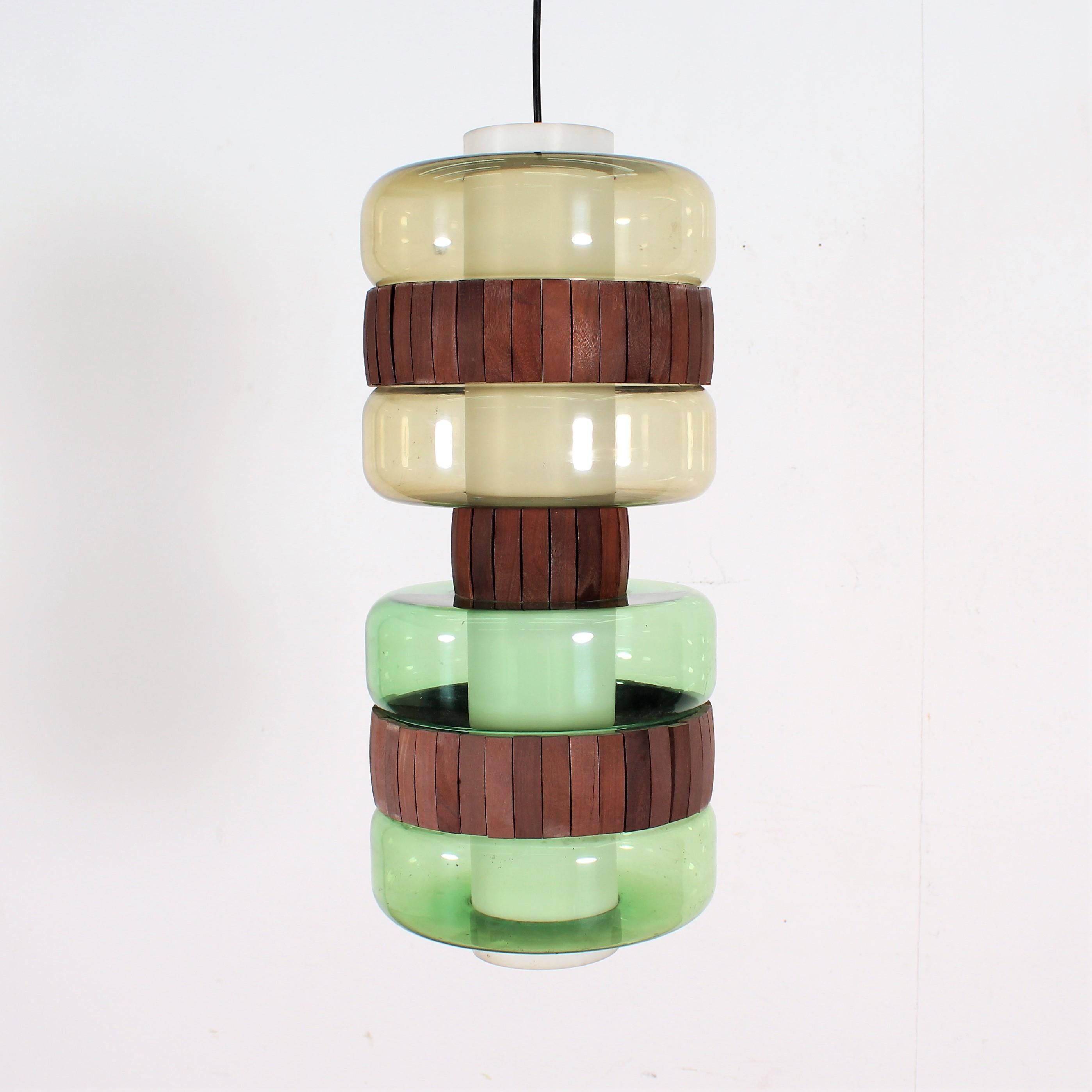A wonderful polychrome pendant chandelier with total 2-light, in Perspex and light wood. Scandinavian production in 1960s. Original in each part.
Wear consistent with age and use.