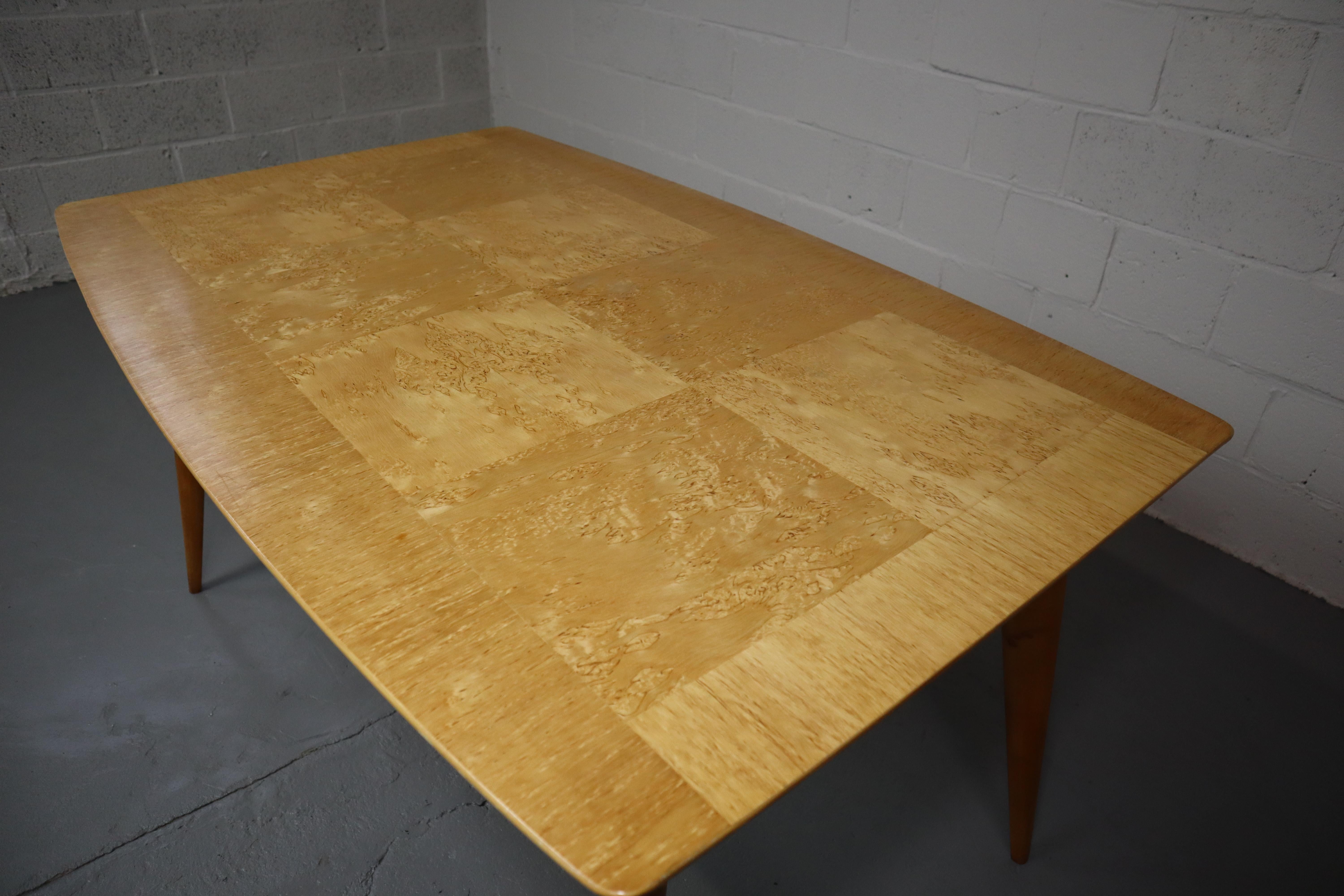 Mid-century Scandinavian dining table in Karelian Birch.
This table is made of birch wood. The table top is made of Karelian birch veneer (also called Curly Birch).
This variety of the common Birch has a genetic defect that causes the tree to have
