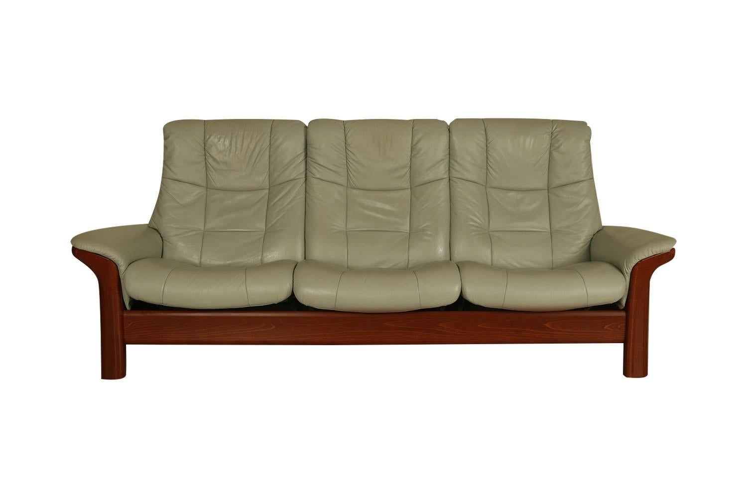 Mid-Century Modern, stylish 3 seat Ekornes Stressless reclining sofa manufactured by Ekornes in Norway.  This outstanding high back sofa features rich, leather upholstery, and adjustable, reclining back support.  All three seats recline and feature