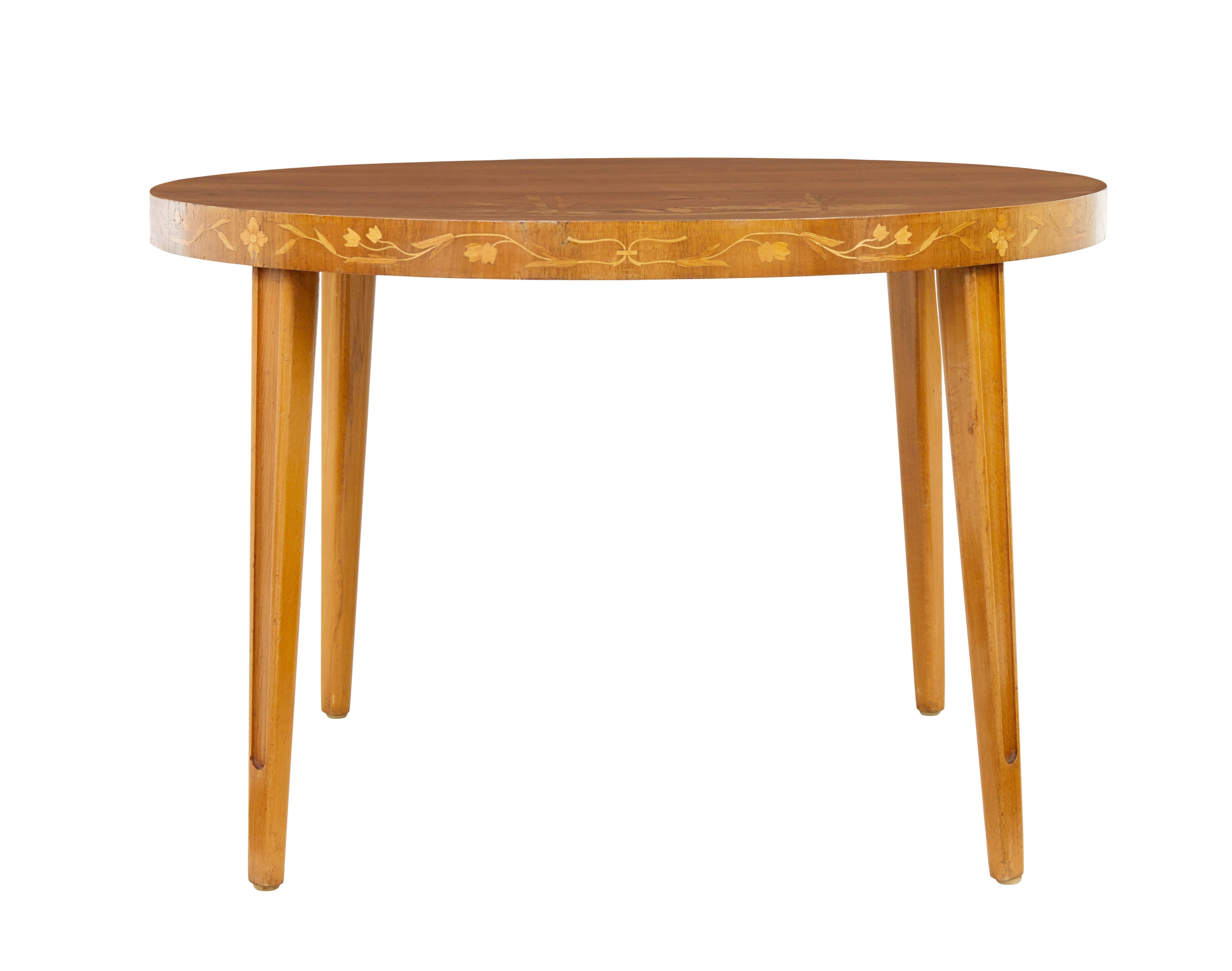 Mid century Scandinavian inlaid elm coffee table circa 1950.

Good quality circular coffee table made in Sweden.  Fine mid century design but with a strong influence from the art deco period.  Beautifully inlaid with burr's and figured timbers to
