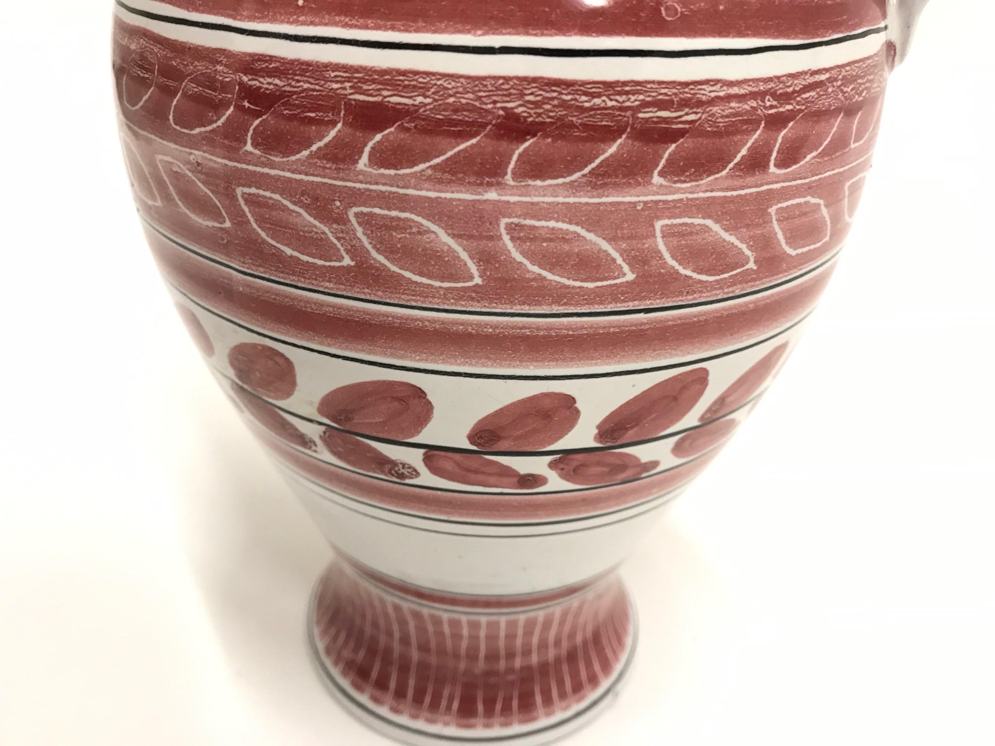 Midcentury Scandinavian Kåre Berven Fjeldsaa red and white vase, signed KBF
Red and white vase with leaf and stripe patterns, signed KBF at base

Kåre Berven Fjeldsaa (1918–1991)
education/utdannelse: 1936-1946, ceramist apprenticeship with Jens