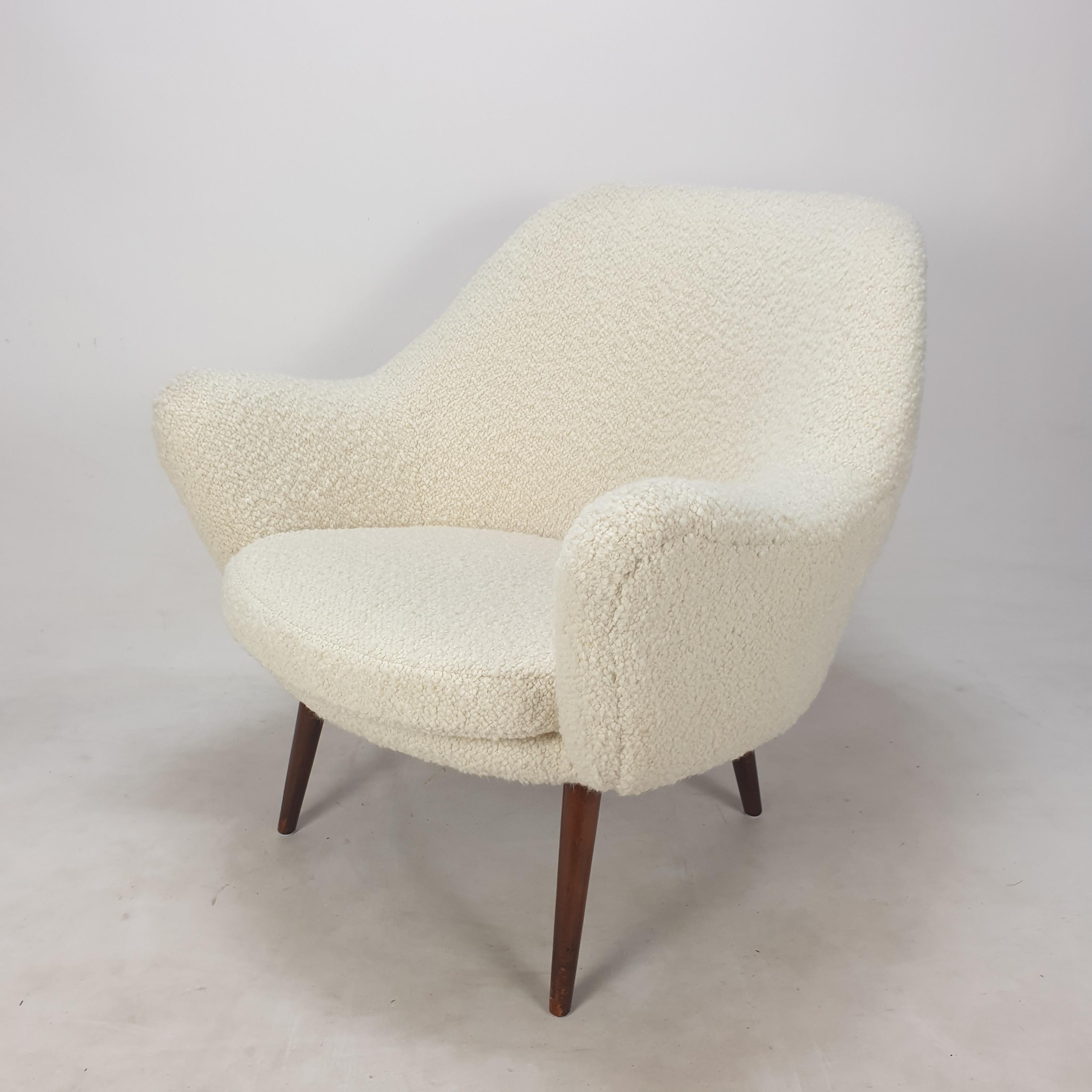 Stunning lounge chair designed and produced in Scandinavia, 1950's. 
It has a very comfortable seat.

The chair is just restored with new foam and new fabric, so it is in perfect condition.

It is reupholstered with very soft and cosy Italian