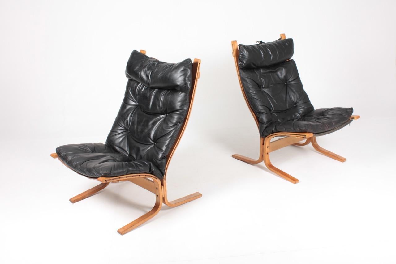 Pair of lounge chairs in patinated leather designed by Ingmar Relling for Westnofa Furniture in 1968. Made in Norway. Great condition.