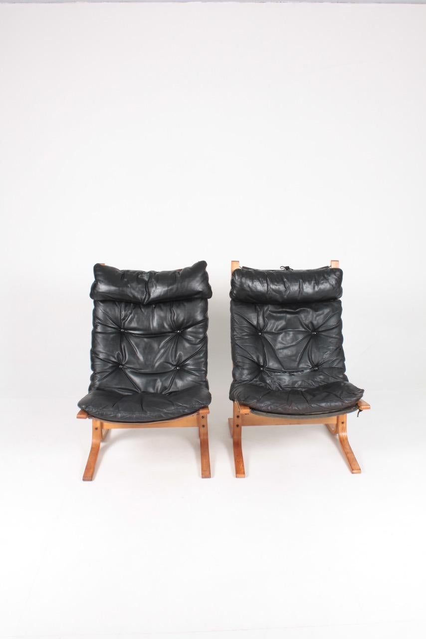 Scandinavian Modern Midcentury Scandinavian Lounge Chairs in Patinated Leather by Ingmar Relling
