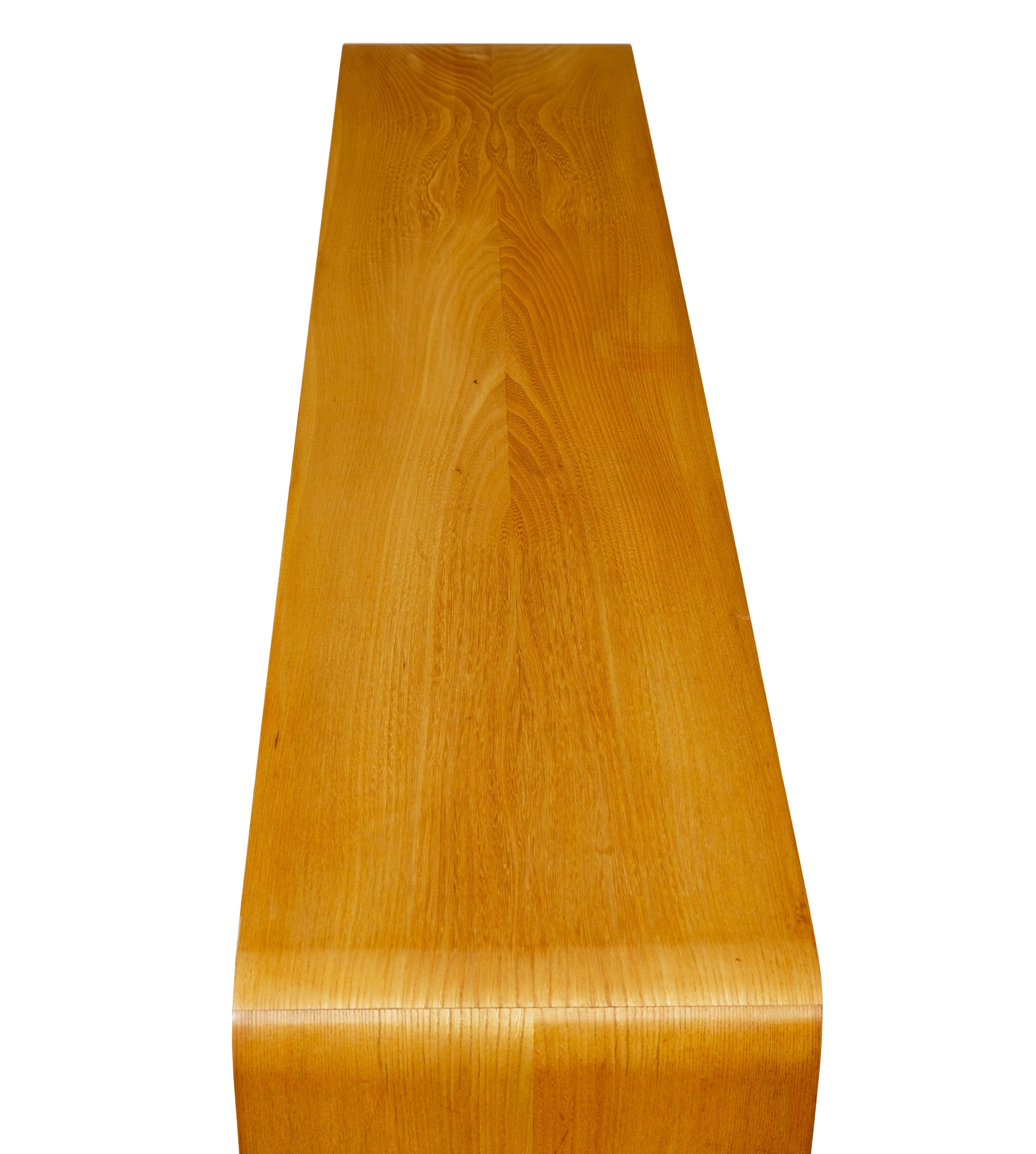 Mid century Scandinavian low open bookcase in elm circa 1950.

Fine example of Swedish mid century design with clear inspiration from the art deco period.

Long narrow shape allows it to work in small spaces without taking up too much room. 