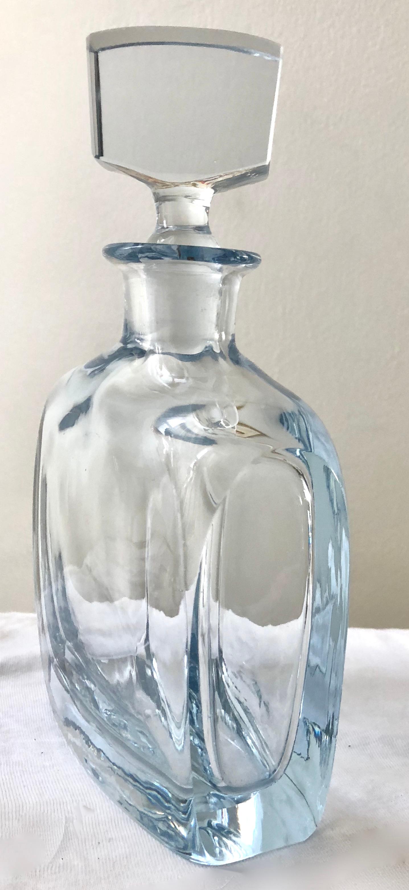 Gorgeous sculptural thick glass bottle, signed, with heavy solid glass stopper. Irresistible.

Courtesy of Pam at WhimsicalVintage:

The Swedish designs of Strombergshyttan are unmistakable. Clean, modern designs of outstanding quality. Founded in