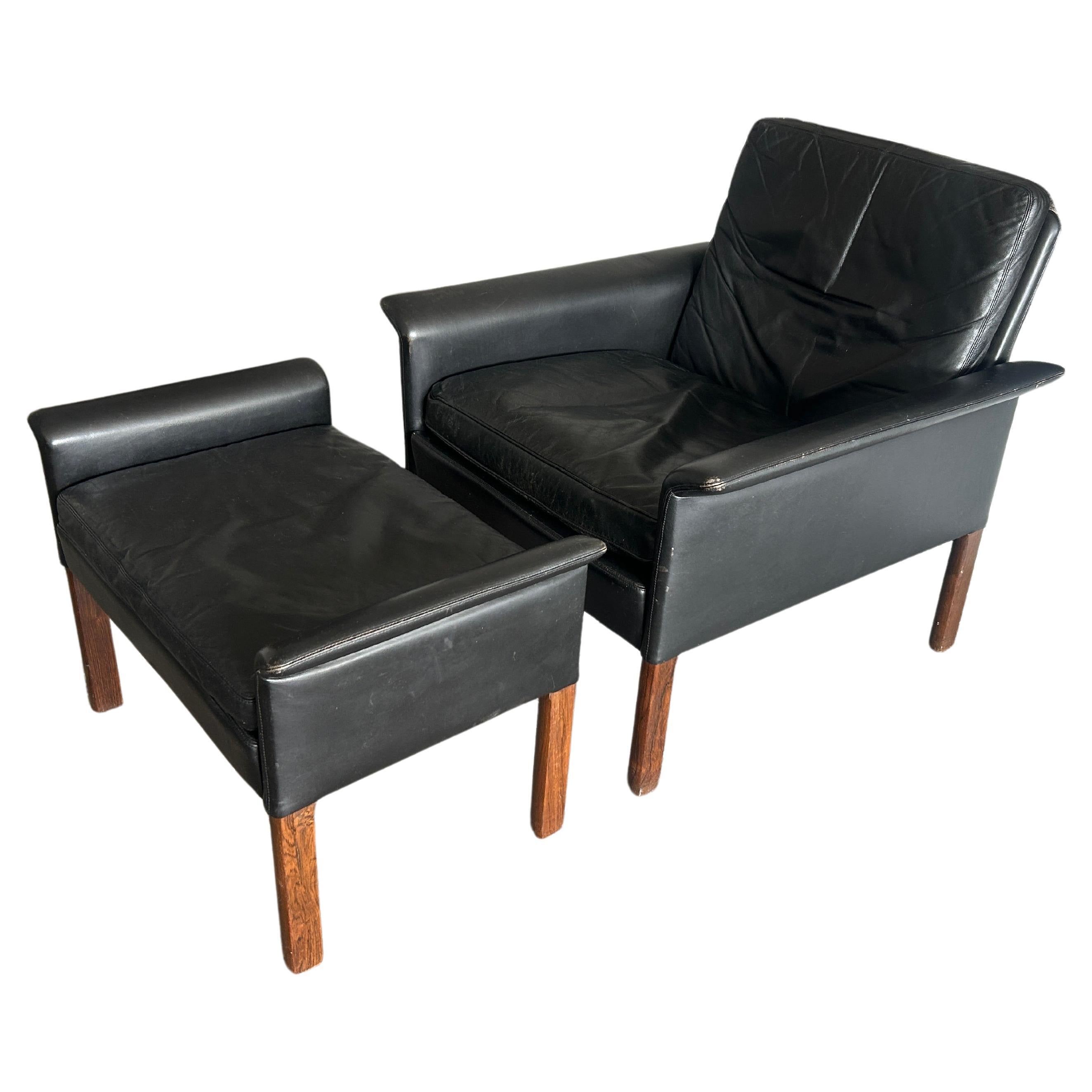 The Moderns Scandinavian modern black leather lounge chair ottoman Hans Olsen en vente