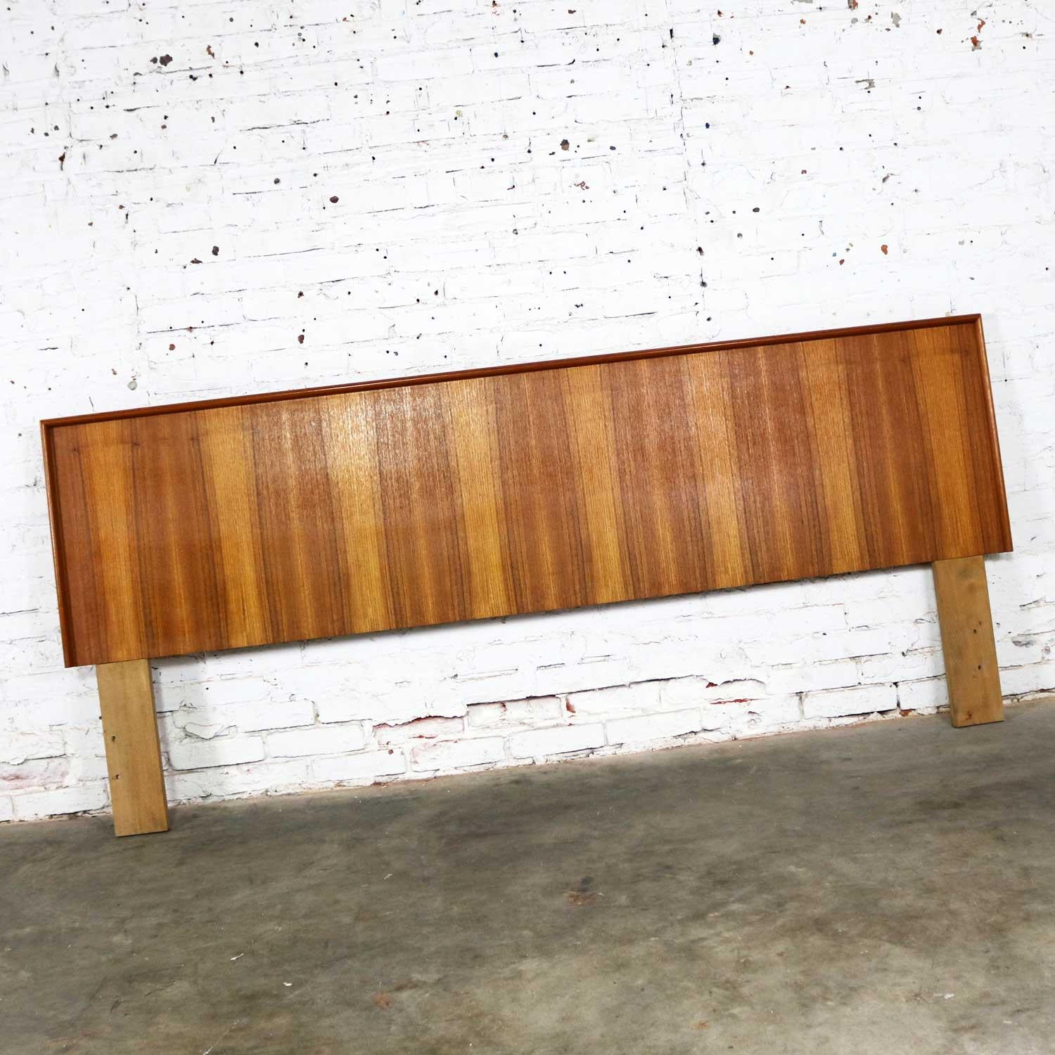 Handsome teak midcentury Scandinavian Modern king size headboard. Ink stamped on the back Made in Denmark and is in wonderful original vintage condition. It does have small dings that come with age but nothing outstanding. Please see photos, circa