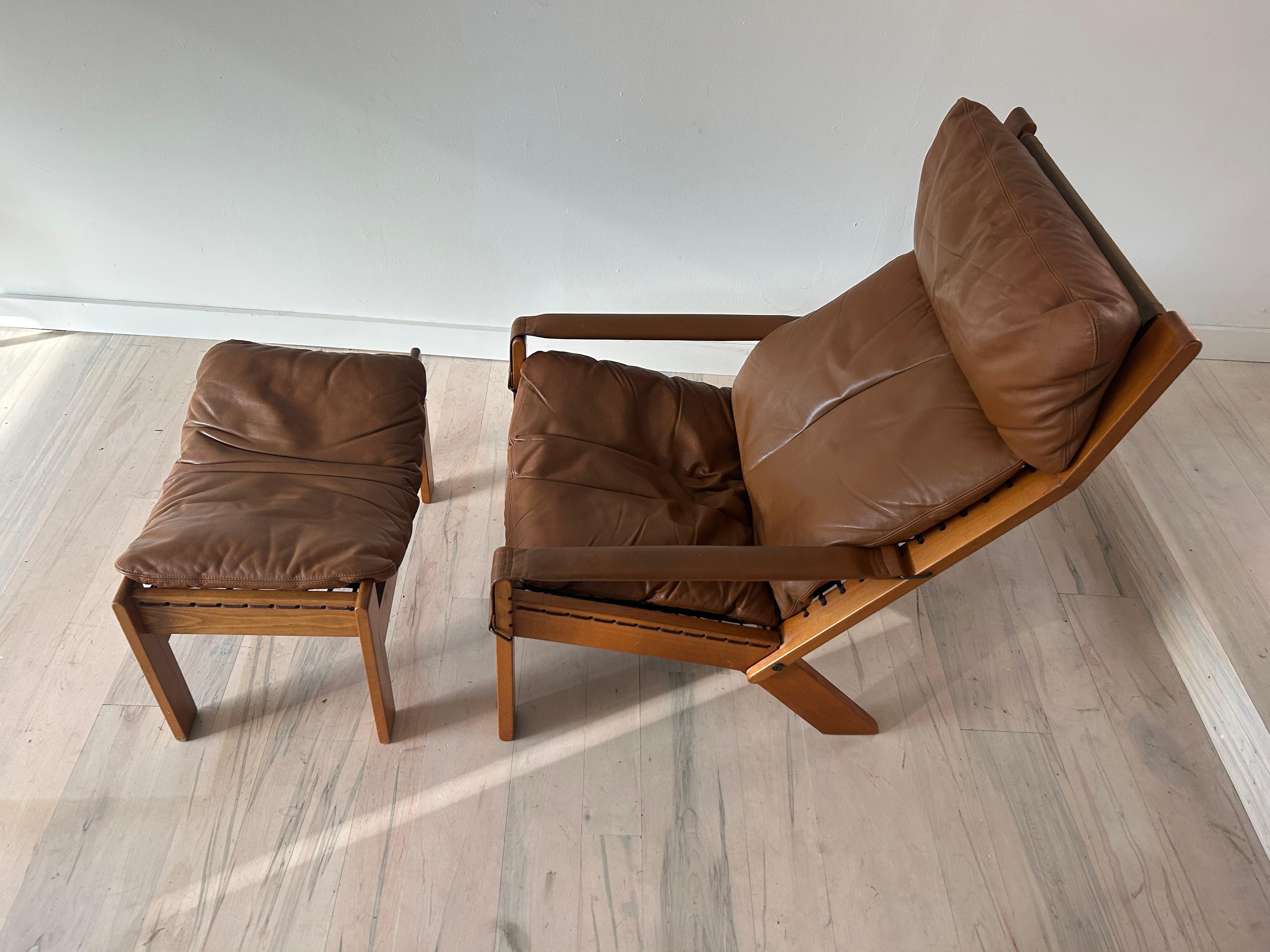 Midcentury Scandinavian Modern leather lounge chair and ottoman by Westnofa.

Westnofa Norwegian modern chair and ottoman. Wooden frame, removable leather chair and ottoman cushions, safari leather sling arms allowing for adjustable reclining.