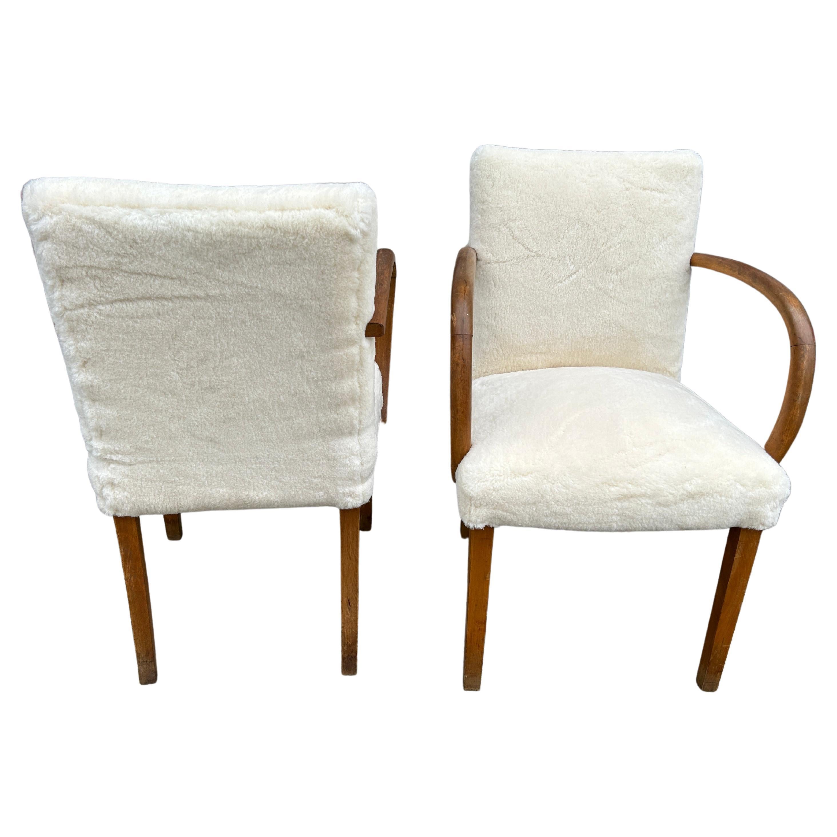 Scandinavian Modern pair of curved armchairs with white Sherpa wool upholstery. Beautiful design circa 1950. Made in Sweden. Located in Brooklyn NYC.

Chairs are being sold as a pair (2) chairs

Dimensions 21” W x 28” D x 33.5” H
Seat Height