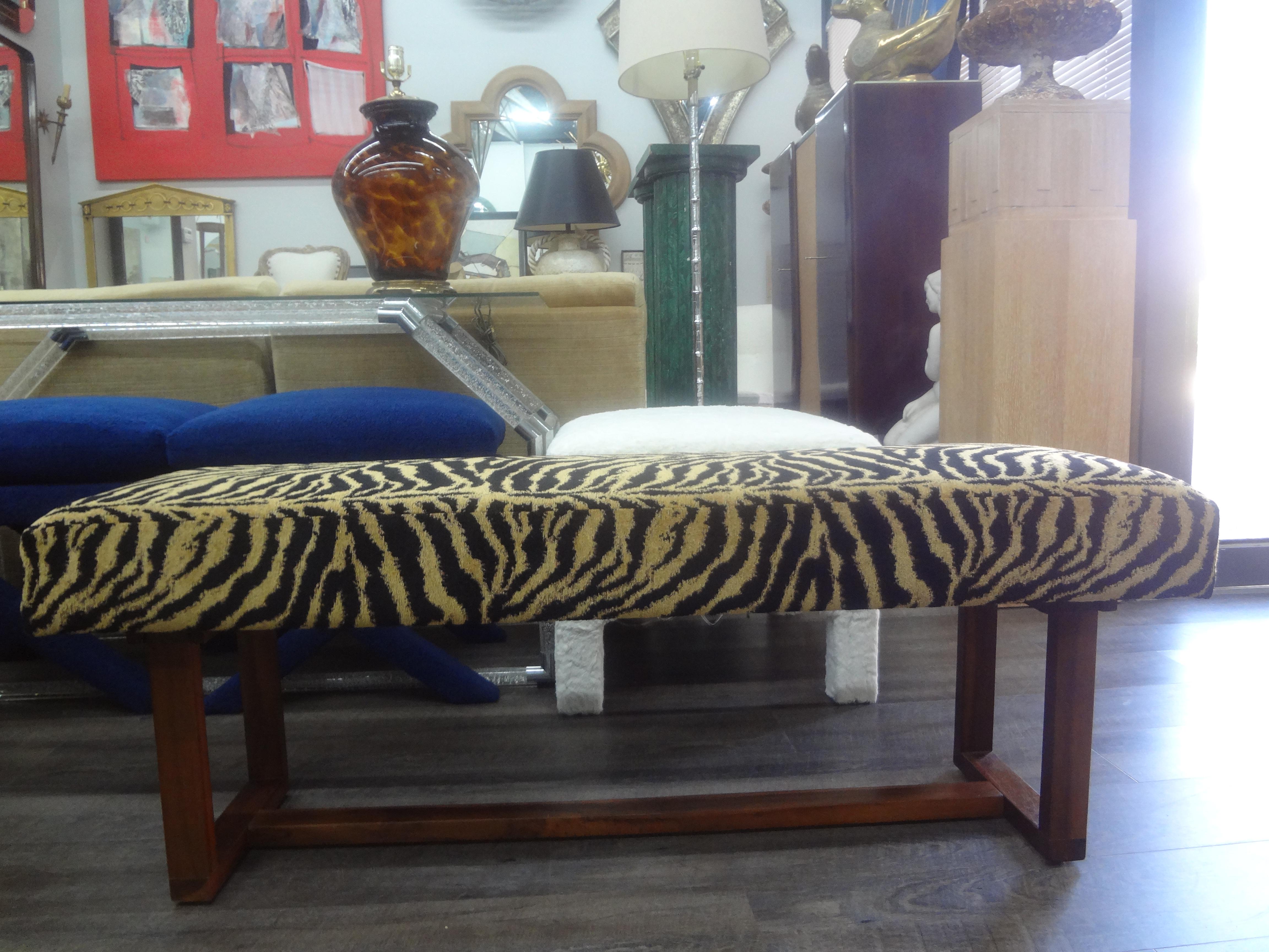 Mid Century Scandinavian Modern Teak Bench.
This stunning modernist teak bench has been professionally upholstered in black and gold tiger print chenille fabric. Great for a hall or at the end of a bed. Easily reupholstered if desired.
We have
