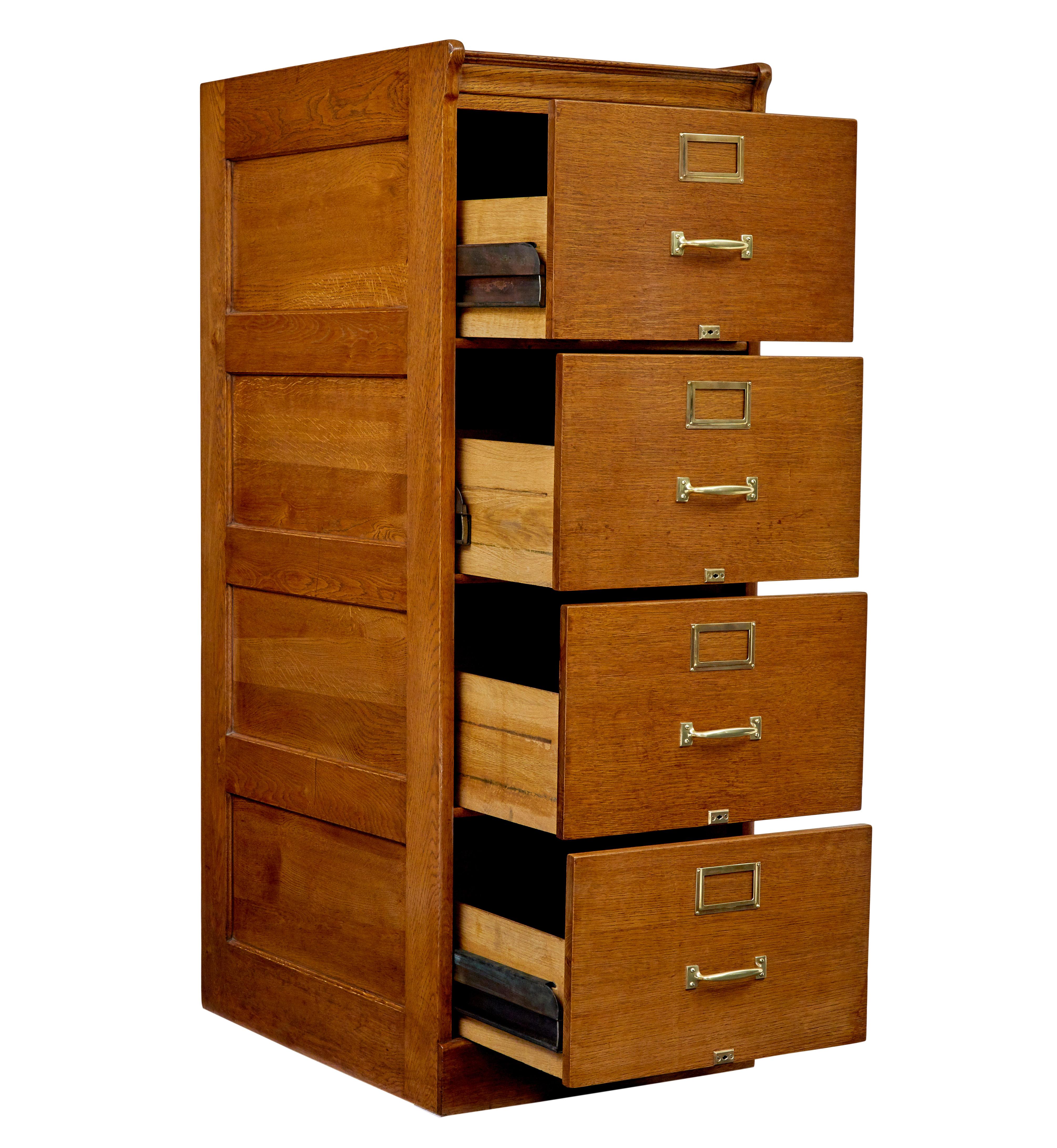 Mid century Scandinavian oak filing cabinet circa 1950.

Fine quality Swedish oak filing cabinet with brass handles and lock plates.

Fitted with 4 deep drawers, each fitted with brass handle, lock plate and label holder.  Top of the cabinet with a
