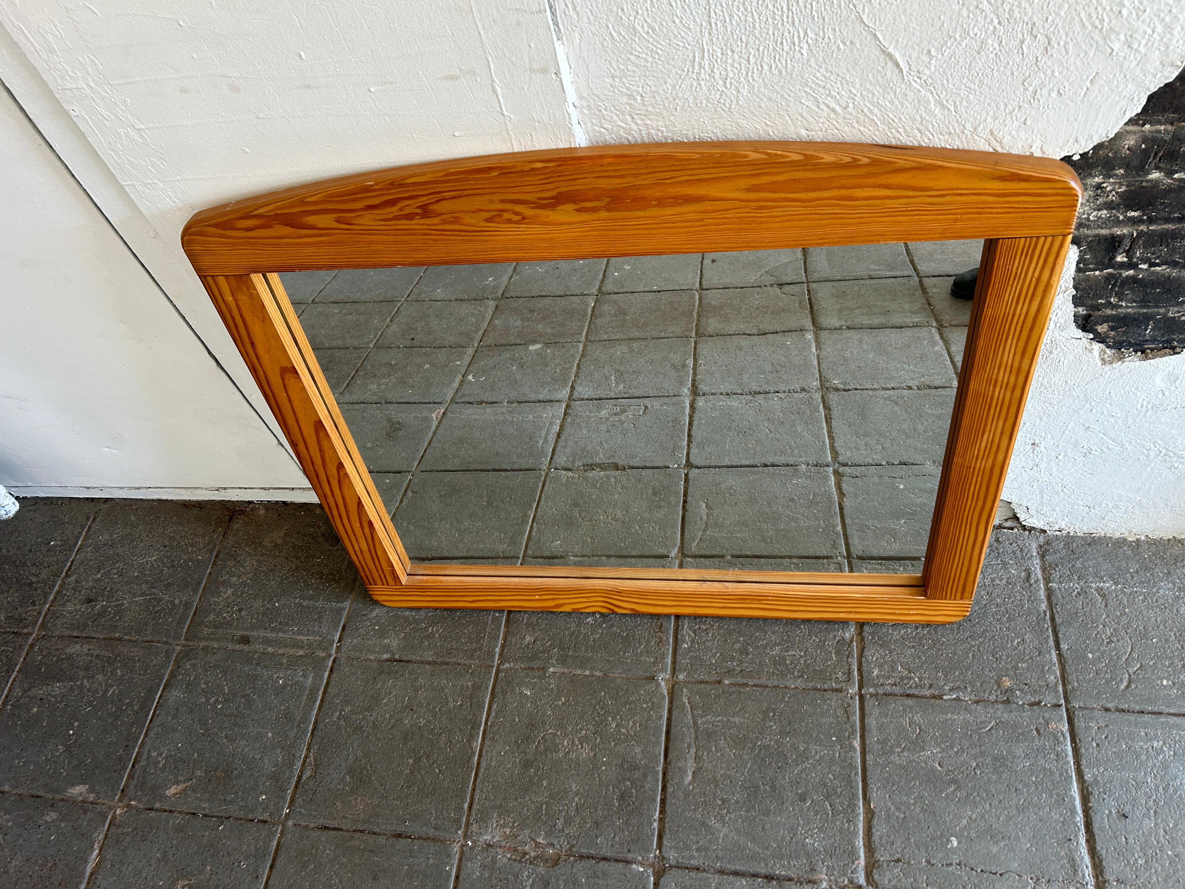 Mid century Scandinavian modern horizontal wall mirror. Solid pine wood frame with curved top and thick mirror. Wired to hang horizontal. Located in Brooklyn NYC.

43” w x 36” h x 1.5” thick
