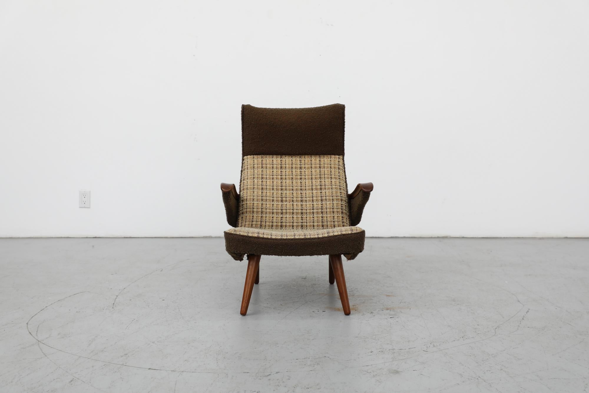 Mid-Century armchair with original green and plaid upholstery and beautifully carved teak armrests. This chair has a beautifully classic Scandinavian design with tapered legs, tilted headrest and slight curves. The armrests and legs have been