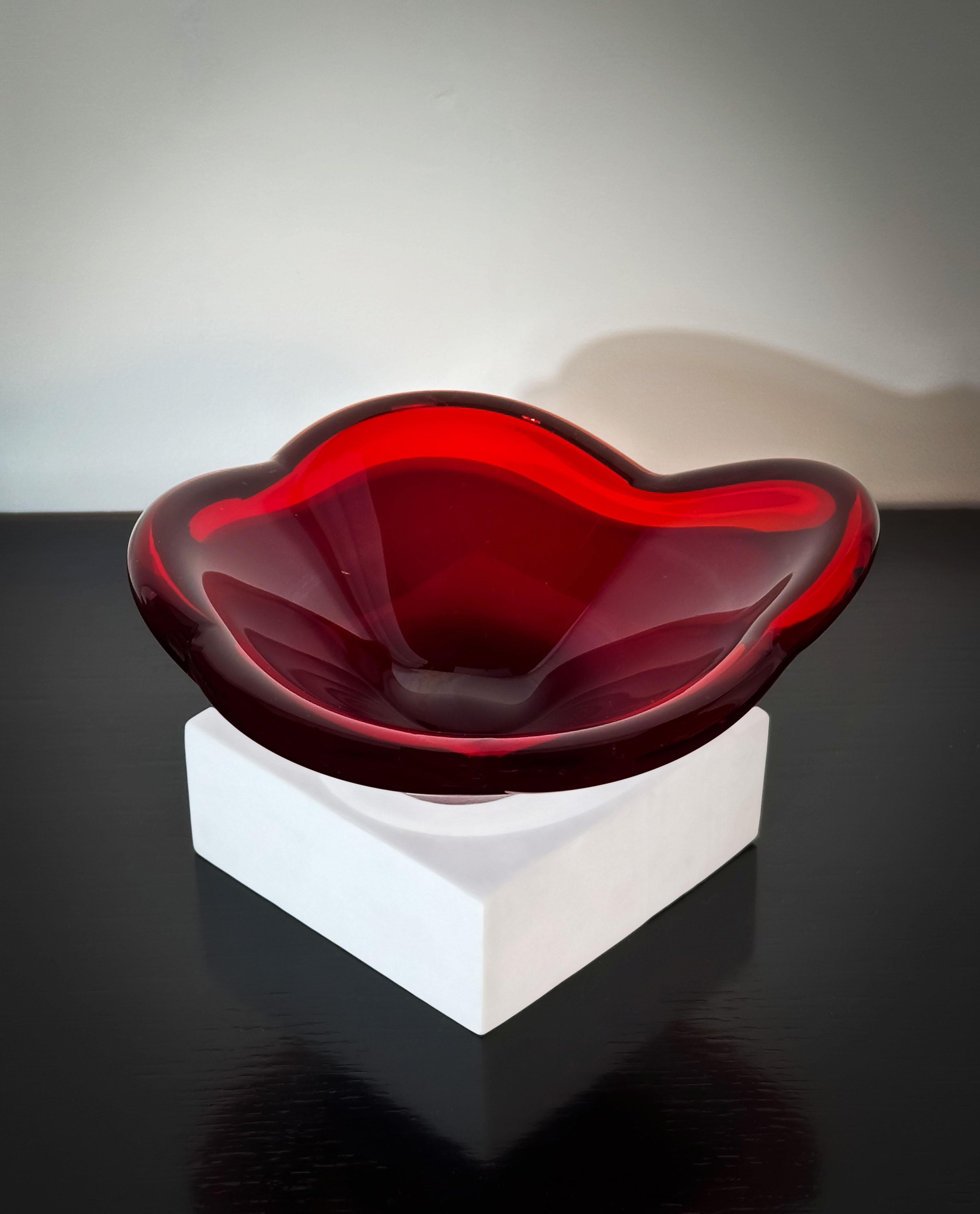 A bold ruby red mid-century glass dish, crafted in the iconic 