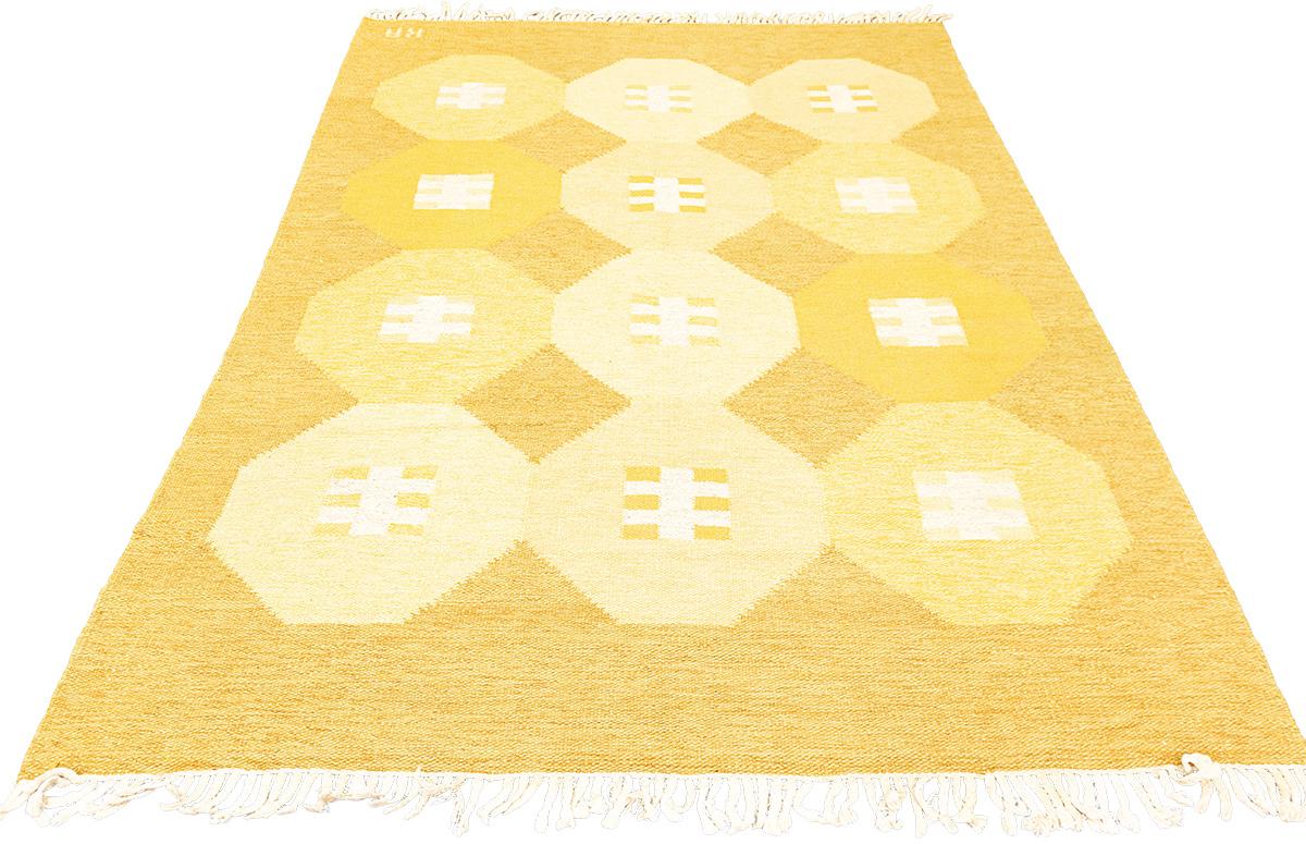 This unique midcentury Scandinavian Rug is simply breathtaking! Perfect for any room, its three columns of octagon designs combined with a flag-like pattern make it stand out from the crowd. Rich, warm colors such as shades of brown, orange