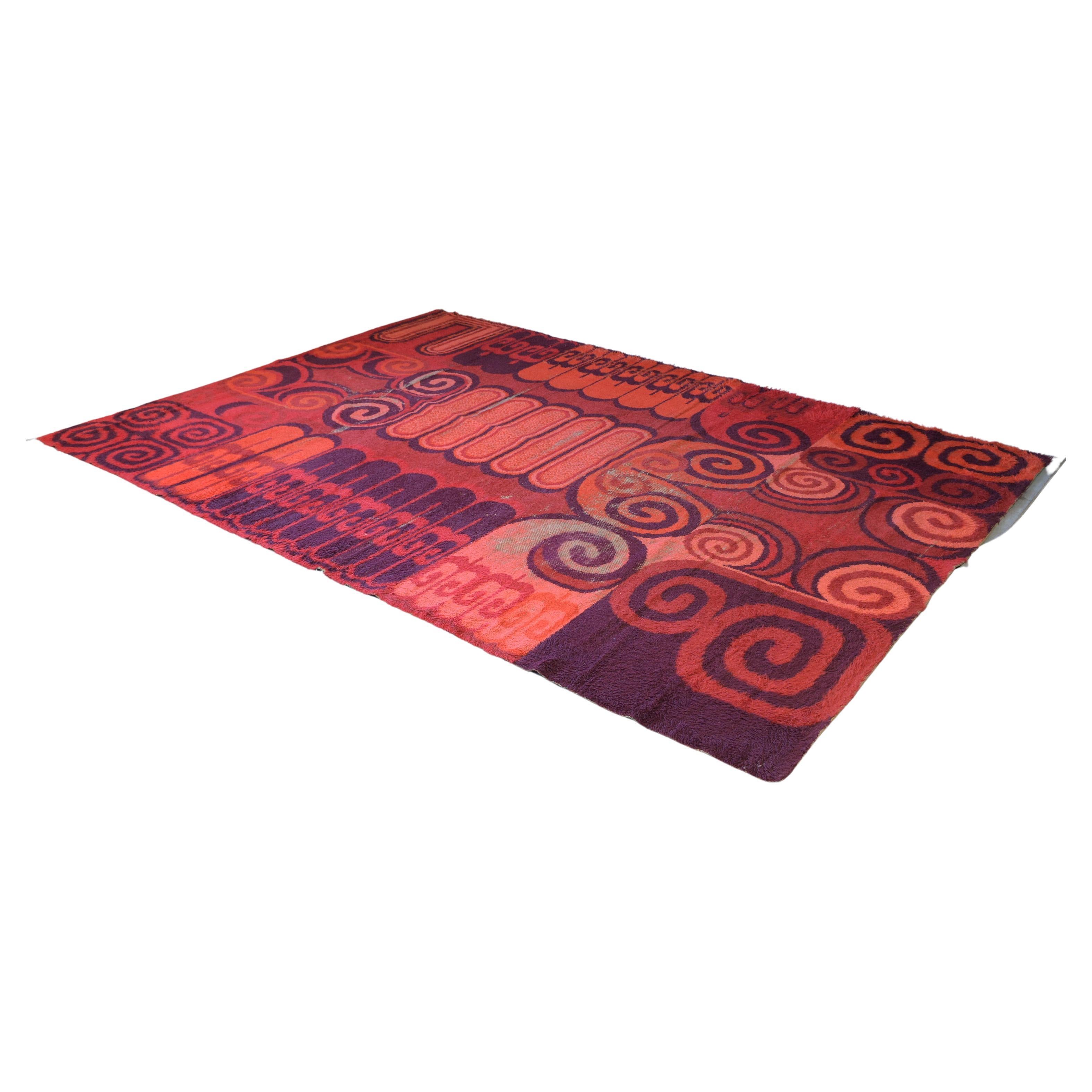 This vibrant Scandinavian Fire Pattern Shag rug by Ege Rya has a thick wool pile, with vibrant colors in red, orange, pink, and brown colors. This vintage large carpet is sure to add some welcomed color to any inspired sophisticated home decor for
