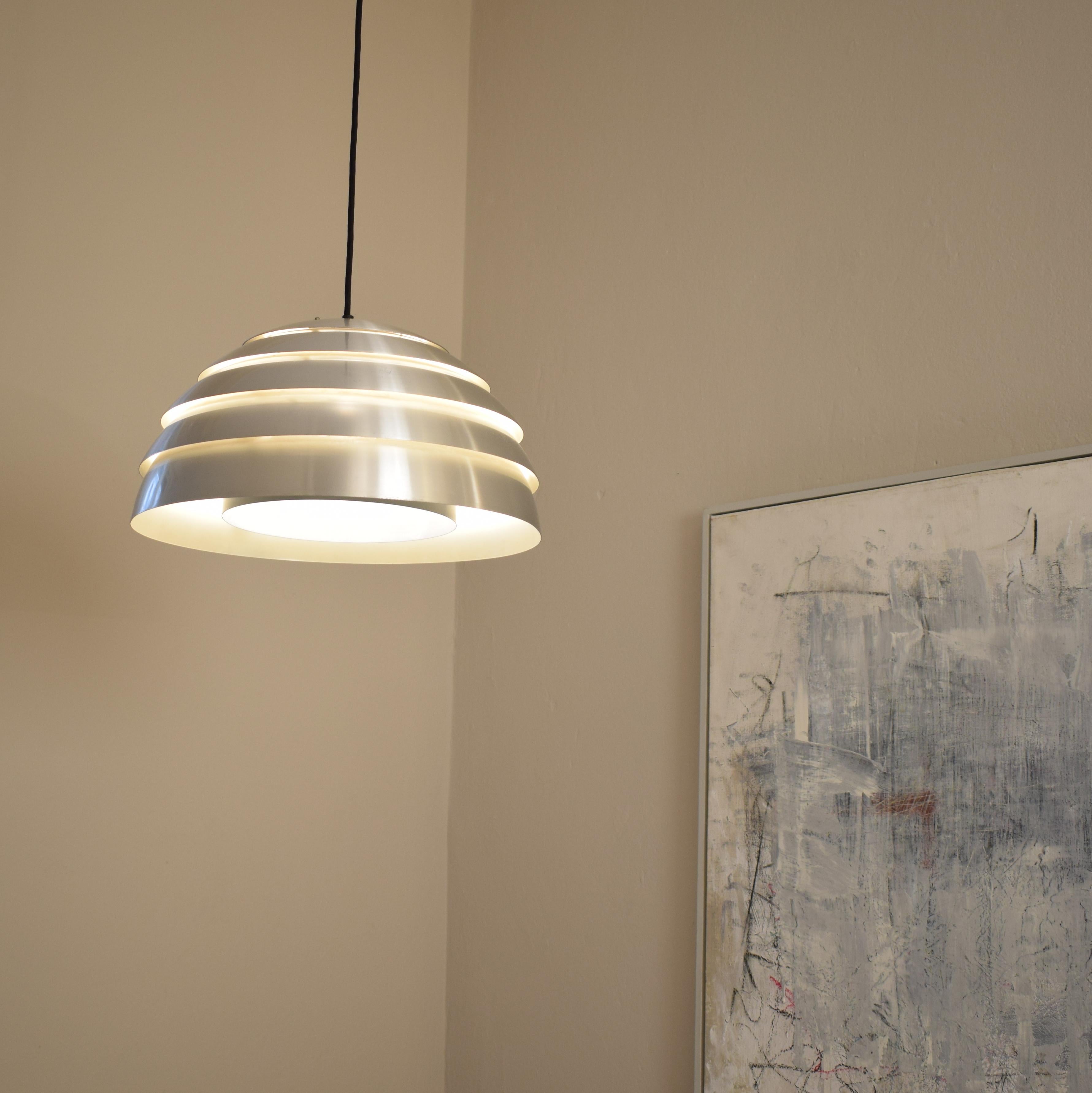 This beautiful midcentury Scandinavian / Swedish chrome pendant was designed by Hans-Agne Jakobsson for Markaryd in the 1960s.
The lamp has got a cable which you can adjust in height. At the moment it is 140cm long.
A unique piece which is a great
