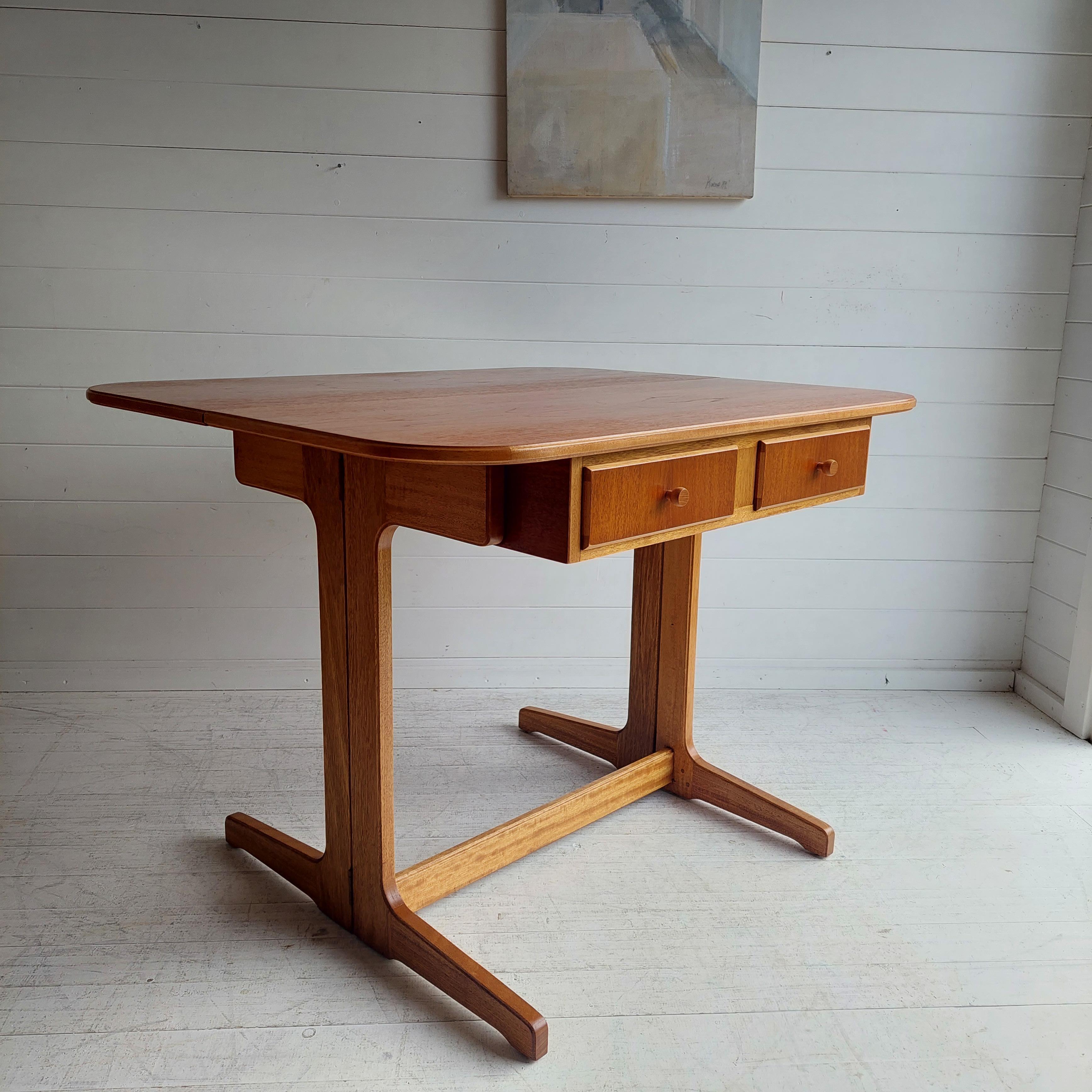 Mid century Restored teak dropleaf writing desk, console or dining table, c1960�’s.
Beautifully constructed from contrasting  teak and oak wood.
Scandinavian design

The desk can be extending quickly and easily by simply lifting the drop leaf and