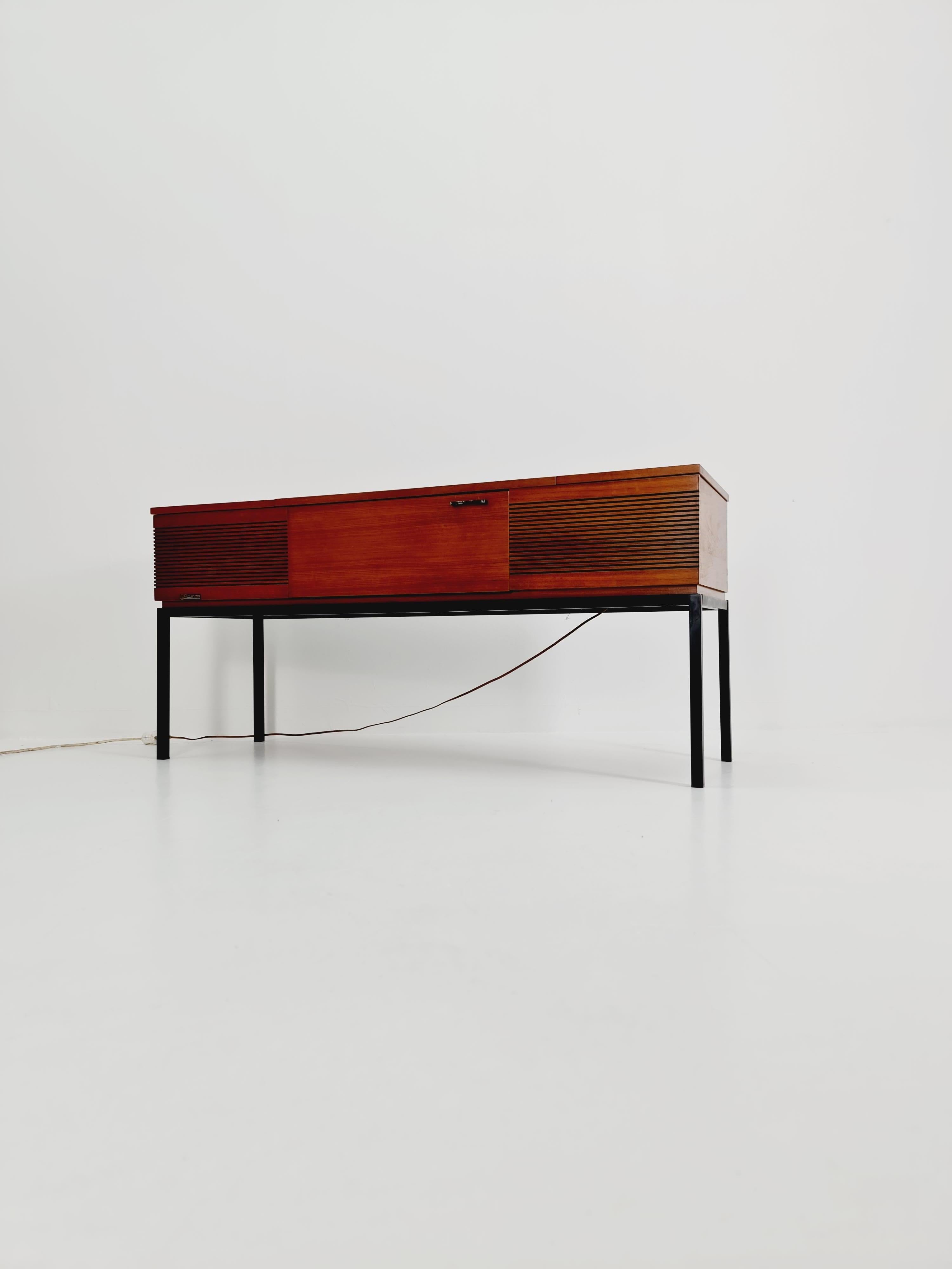 Mid Century Modern scandinavian teak sidboard record player Dual 1210 , radio by Senderwahl 

The radio is in fully functional. as well the vinyl record 
with space of storage 

Dimensions: 
48 D x 148 W x 70 H

It is in good vintage condition,