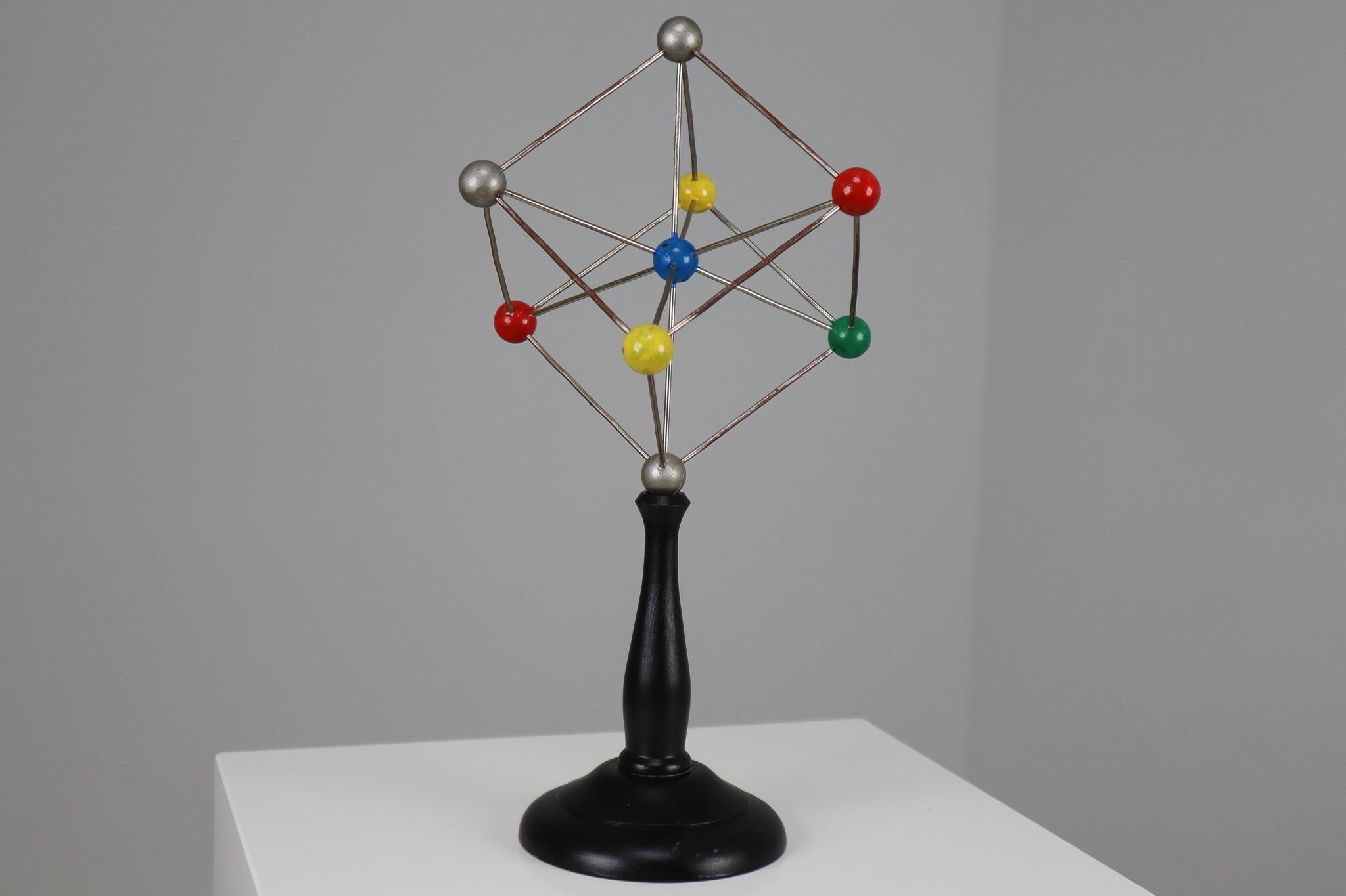 Mid-century decorative ball-and-spoke scientific crystal model from Czechoslovakia from the 1950s. Made for educational reasons, used for classroom demonstration and study. In good condition with signs of age and patina.