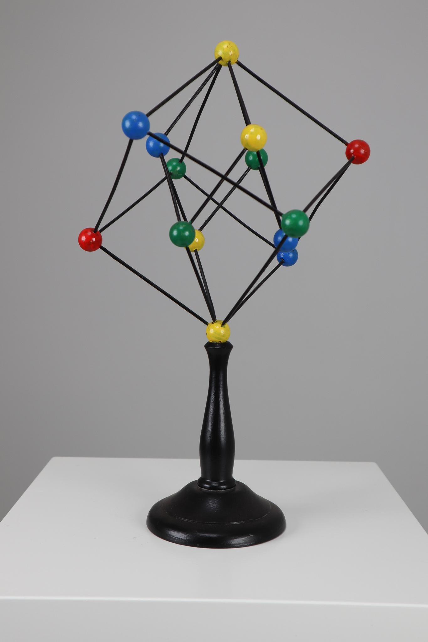 Mid-century scientific crystal model from Czechoslovakia from the 1950s. Made for educational reasons, used for classroom demonstration and study. In good condition with signs of age and patina.