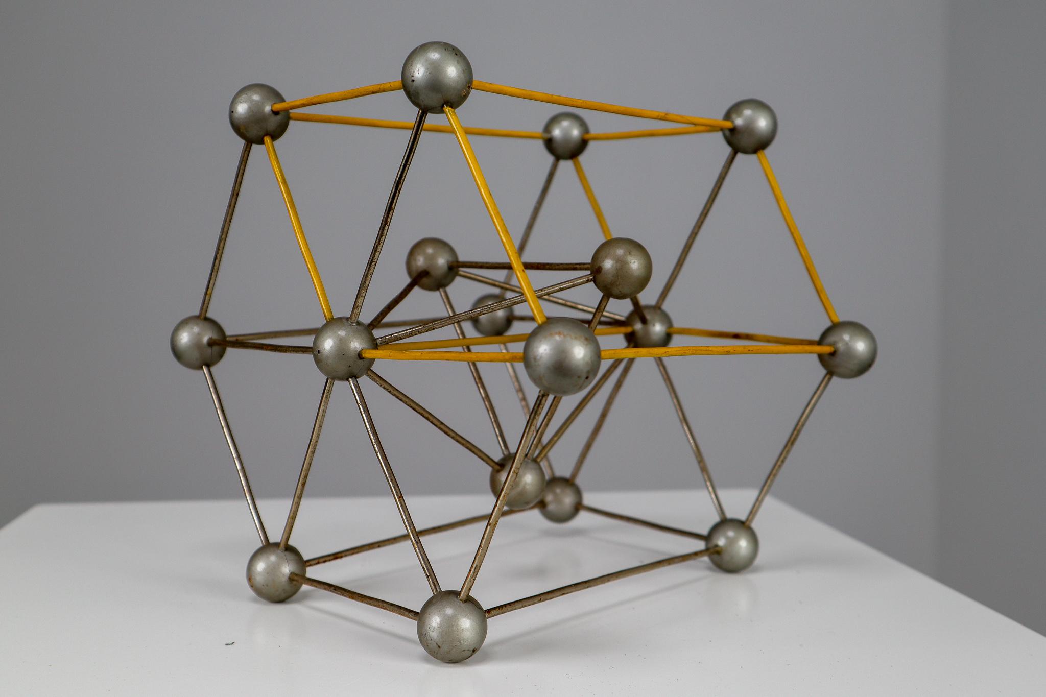 Mid-century decorative ball-and-spoke scientific crystal model from Czechoslovakia from the 1950s. Made for educational reasons, used for classroom demonstration and study. In good condition with signs of age and patina.