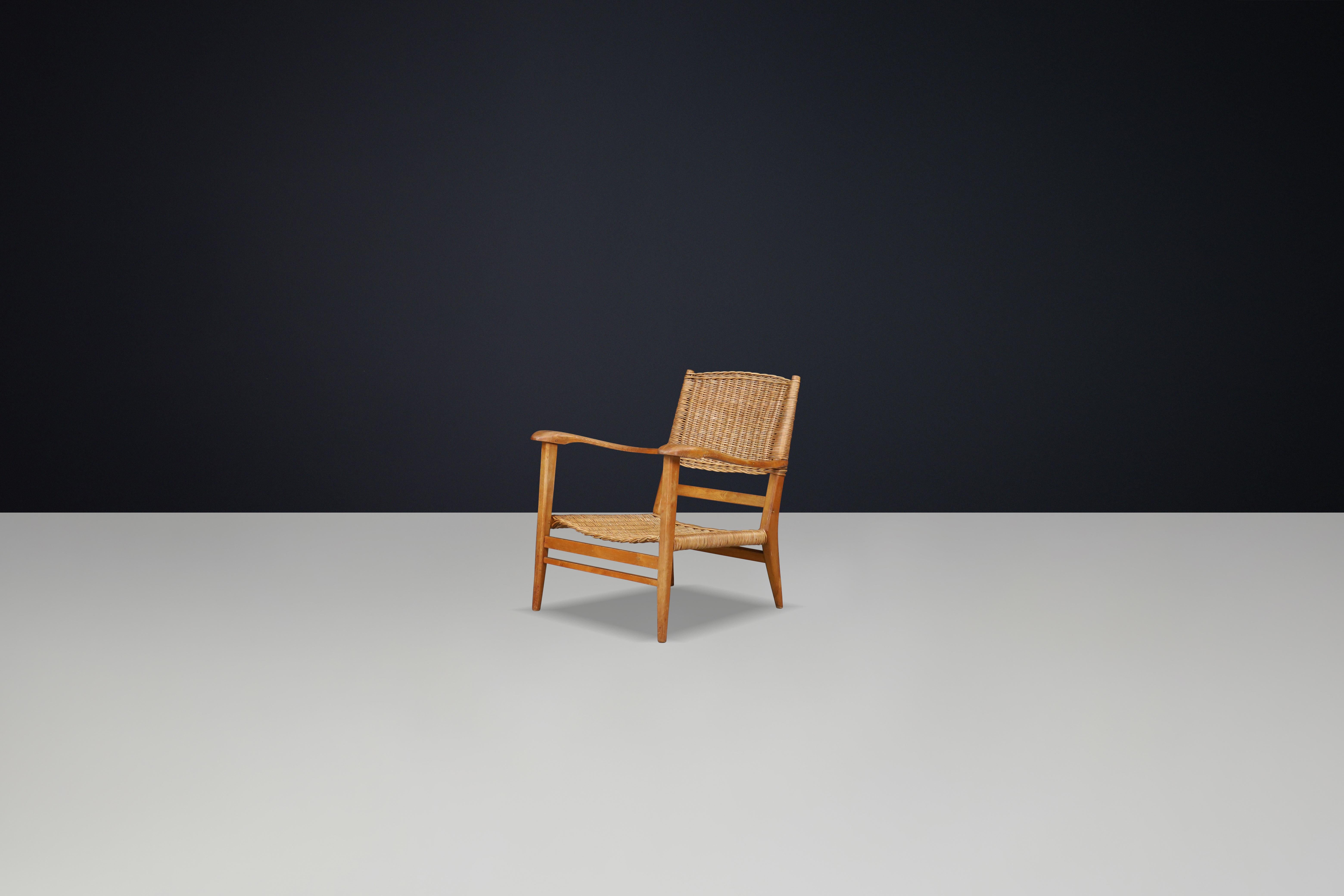 Mid-Century Modern Mid-Century Sculpted Armchair in Oak and Rattan, France, 1950s For Sale