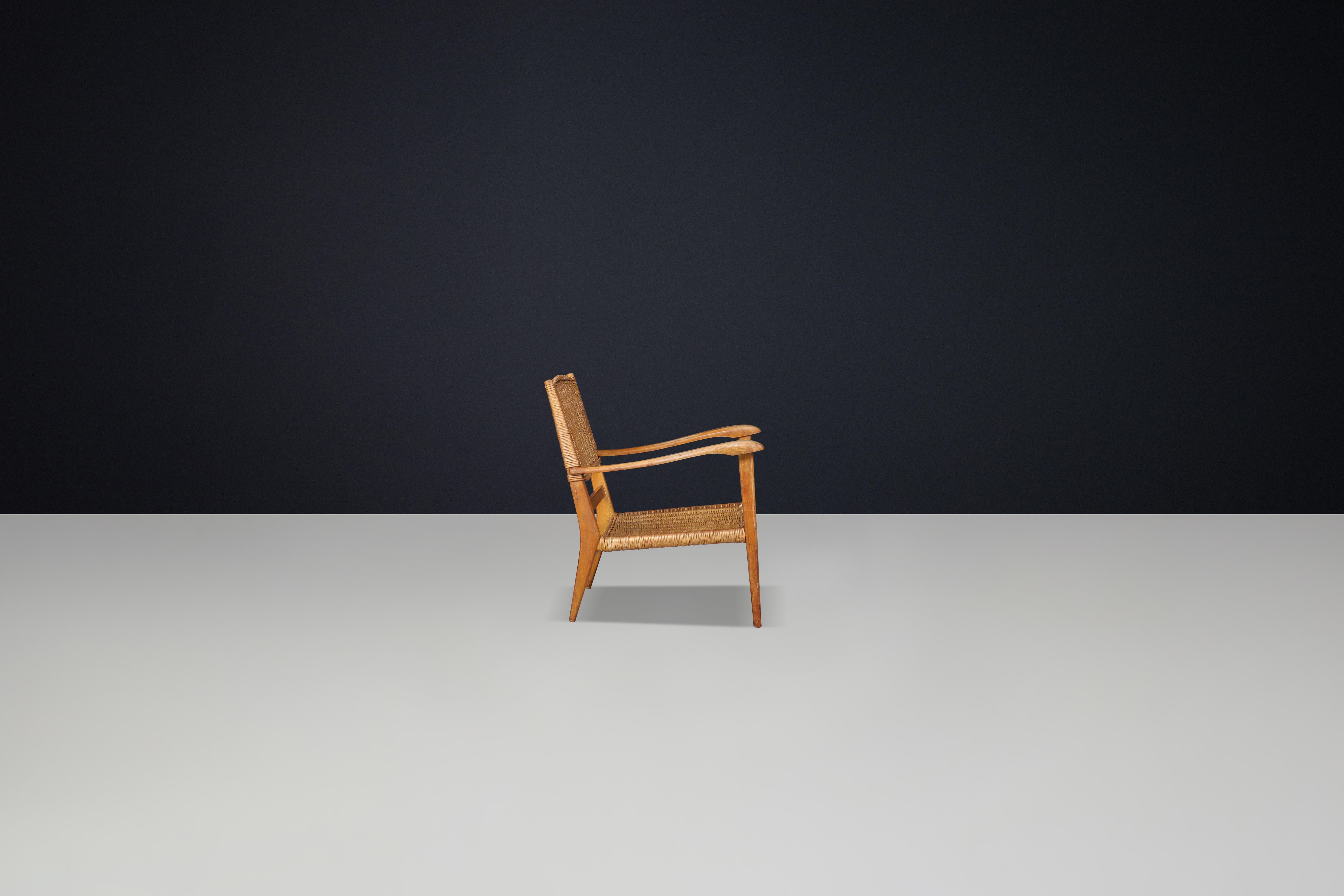 French Mid-Century Sculpted Armchair in Oak and Rattan, France, 1950s For Sale