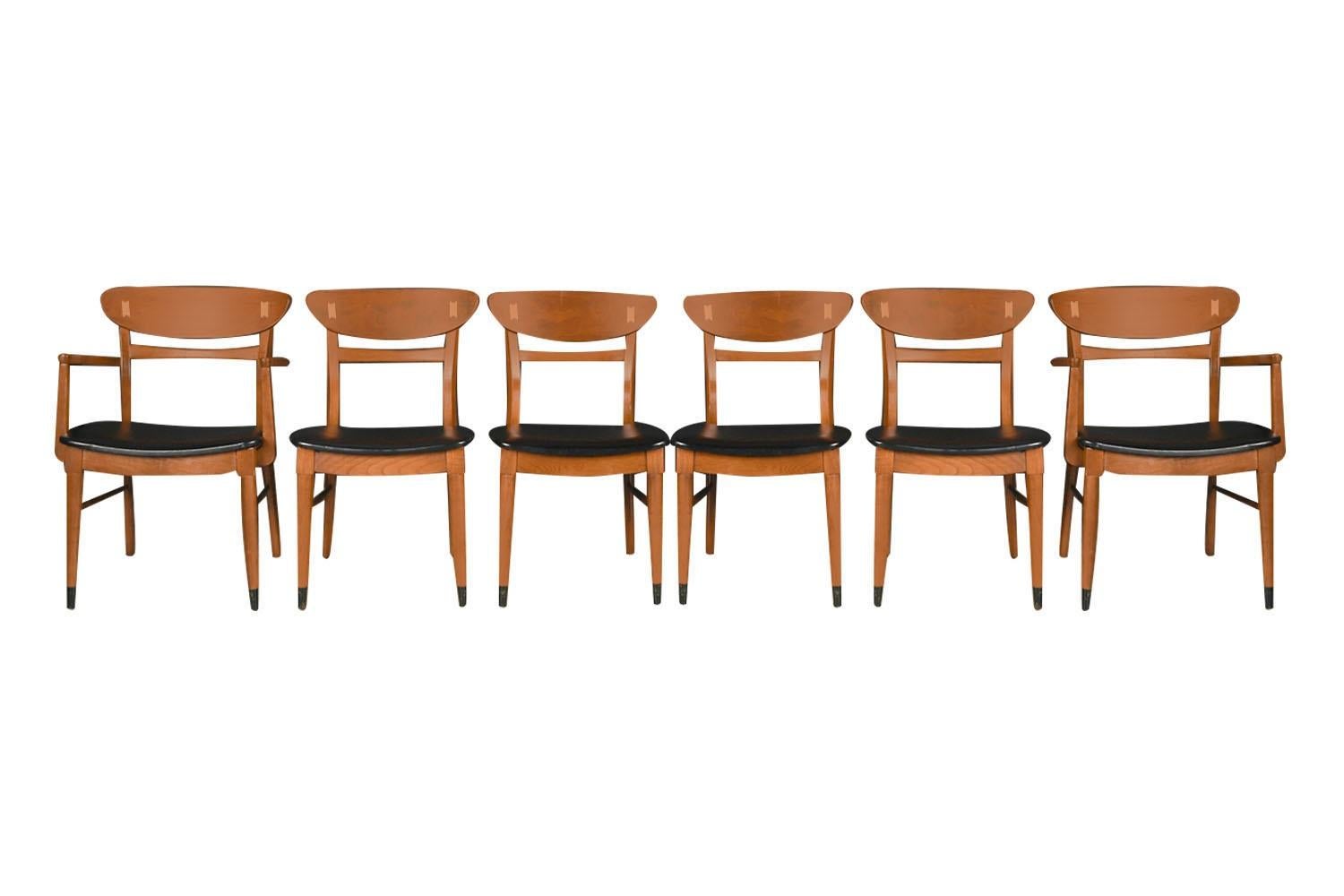 Incredibly well constructed set of six dining chairs from the highly collectible 'Acclaim' series by Lane Furniture, Alta Vista, Virginia circa 1960s. This beautiful rare set of walnut dining chairs designed by Andre Bus feature two captain