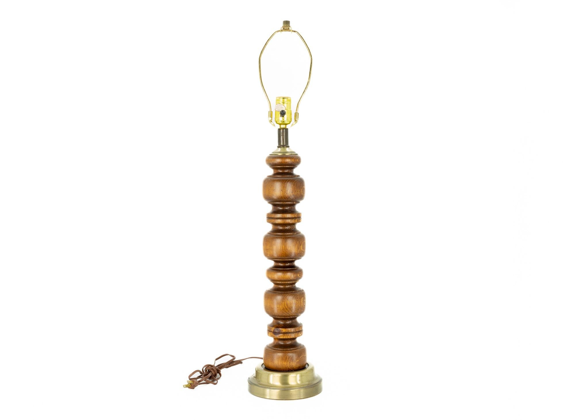 Mid Century Sculpted Walnut and Brass Lamp

This lamp measures: 6 wide x 6 deep x 29.5 inches high

Excellent Vintage Condition

We take our photos in a controlled lighting studio to show as much detail as possible. We do not photoshop out
