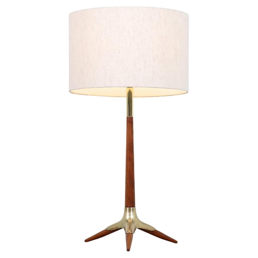 Mid-Century Sculpted Walnut & Brass Tripod Table Lamp by Modeline For Sale