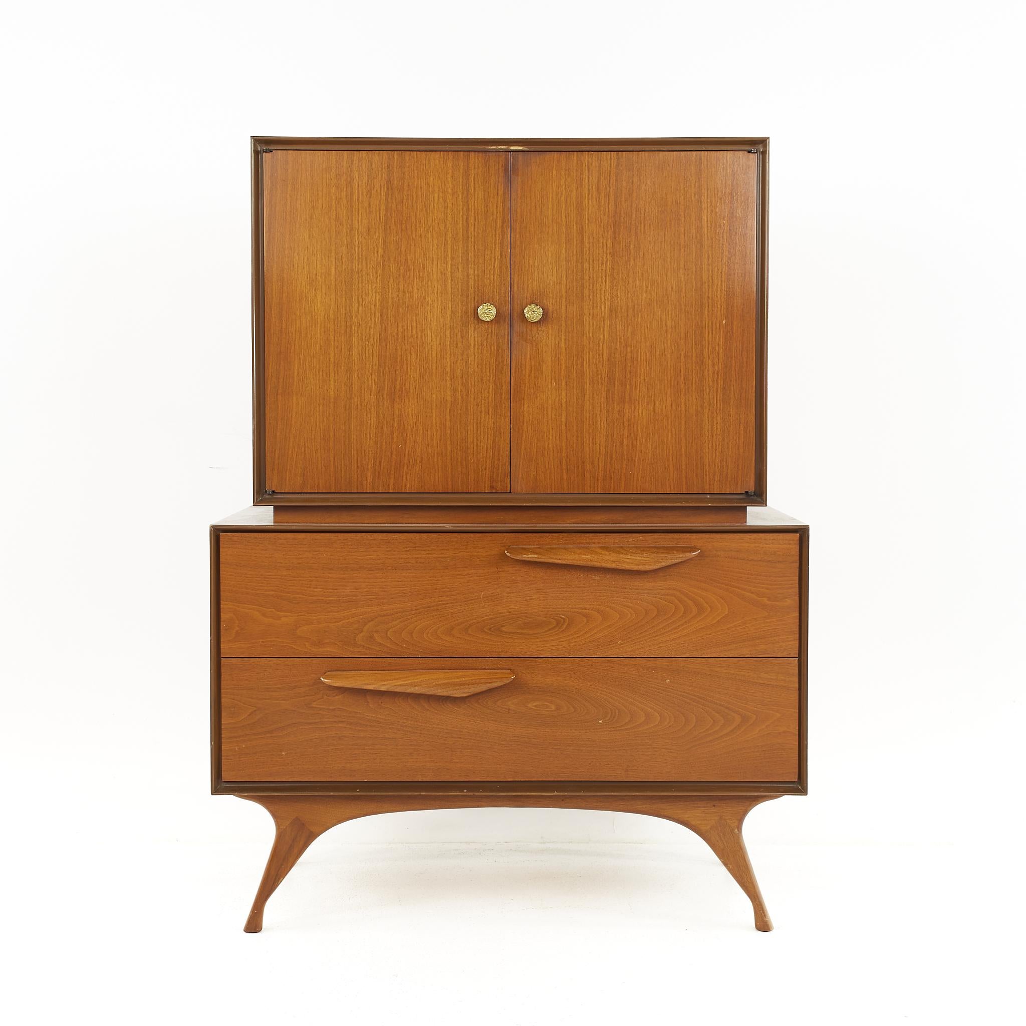 Mid century sculpted walnut highboy armoire gentlemans chest

This armoire measures: 37.5 wide x 20 deep x 50.25 inches high

All pieces of furniture can be had in what we call restored vintage condition. That means the piece is restored upon