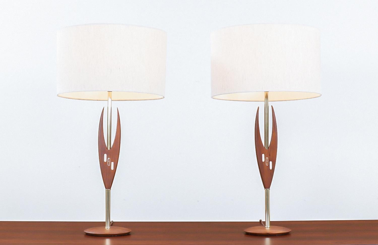 Midcentury sculpted walnut and inlaid tile table lamps.

This product is a set 