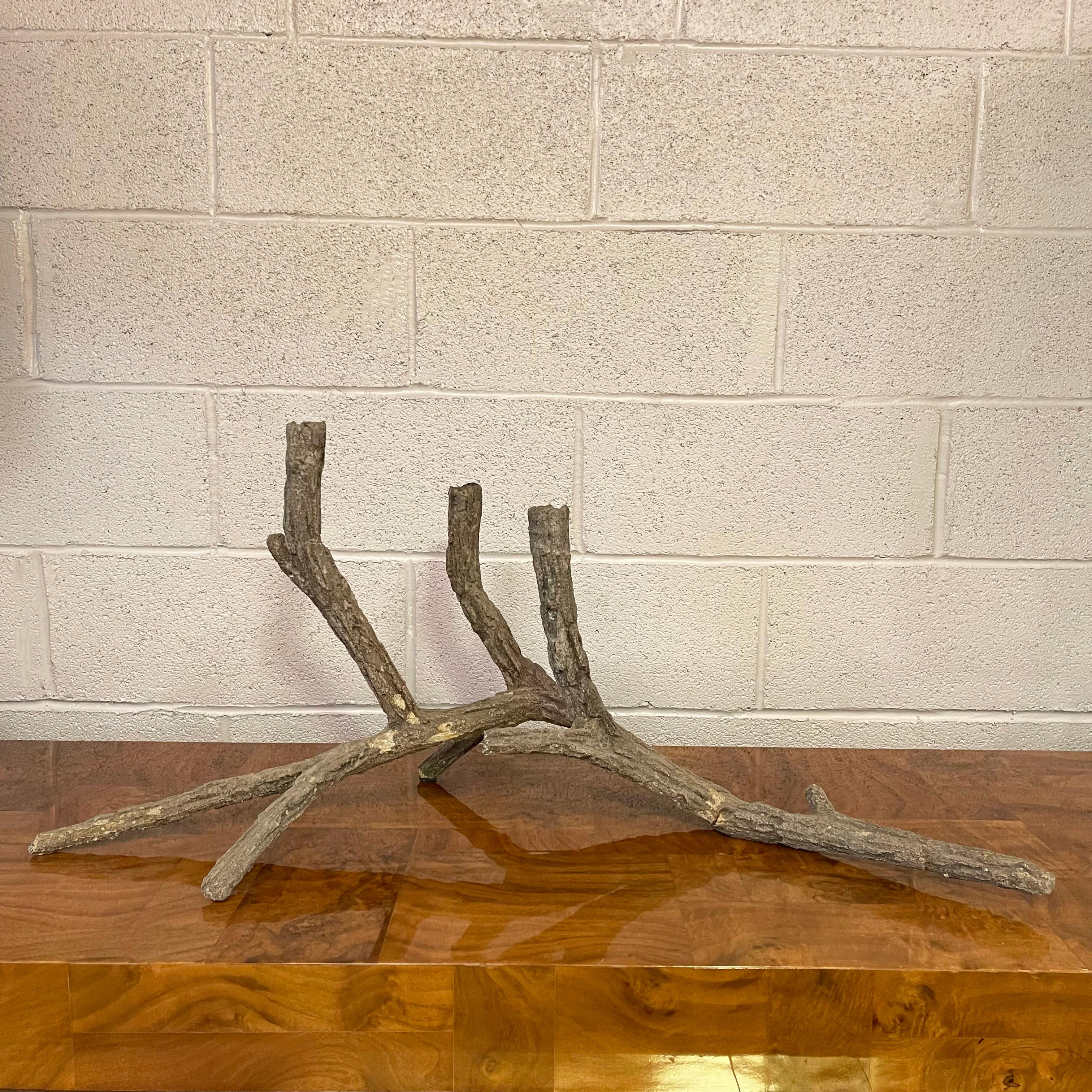 Impressive, mid-century, sculptural, concrete candelabra in the form of an elegant, weathered piece of driftwood or fallen branches that holds three candles for a dramatic table top display. This piece works just as well as an organic sculpture as
