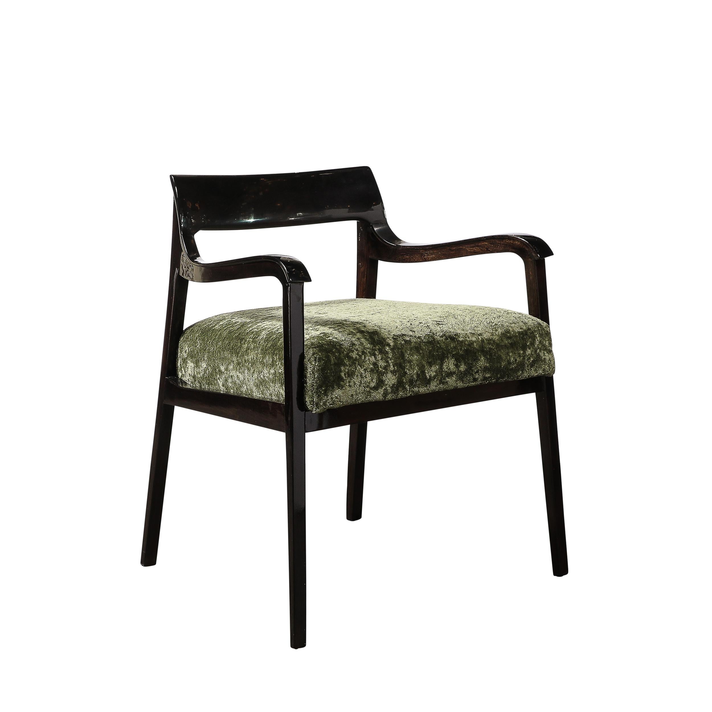 This thoughtfully formed and elegant Pair of Mid-Century Modernist Sculptural Arm Chairs in Ebonized Walnut and Holly Hunt Upholstery originate from the United States, Circa 1960. Featuring a framework rendered in ebonized walnut with a serene,