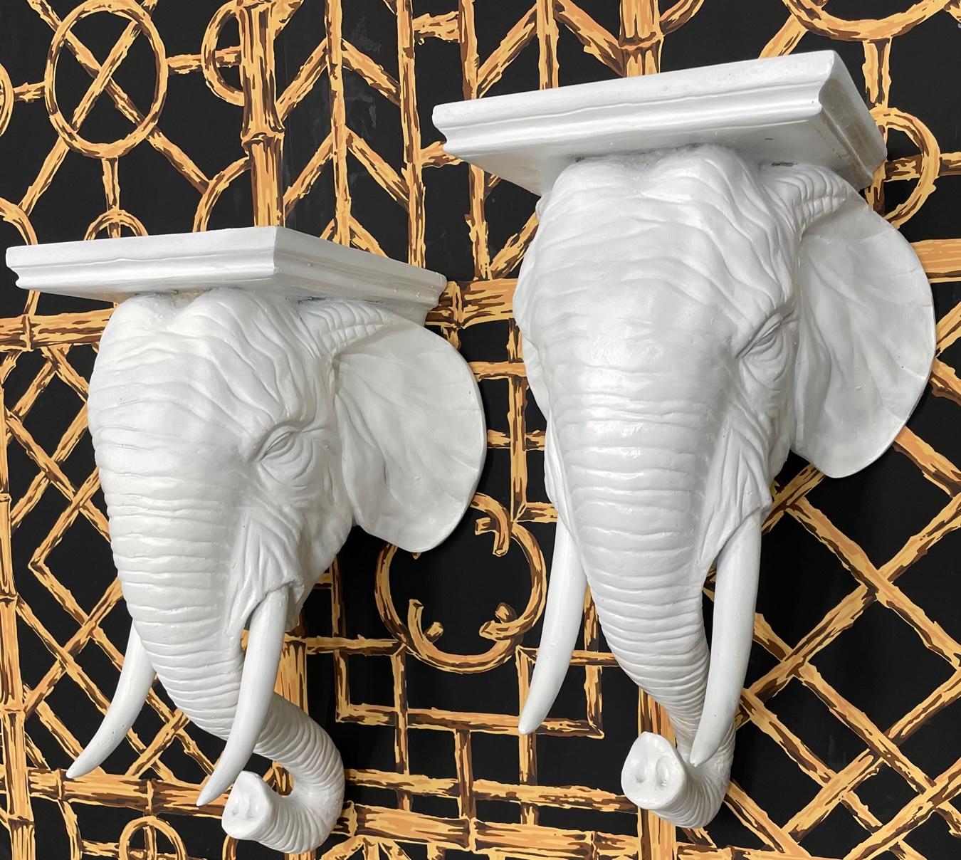 Pair of mid century wall brackets feature molded elephant heads with long tusks and a 9.5