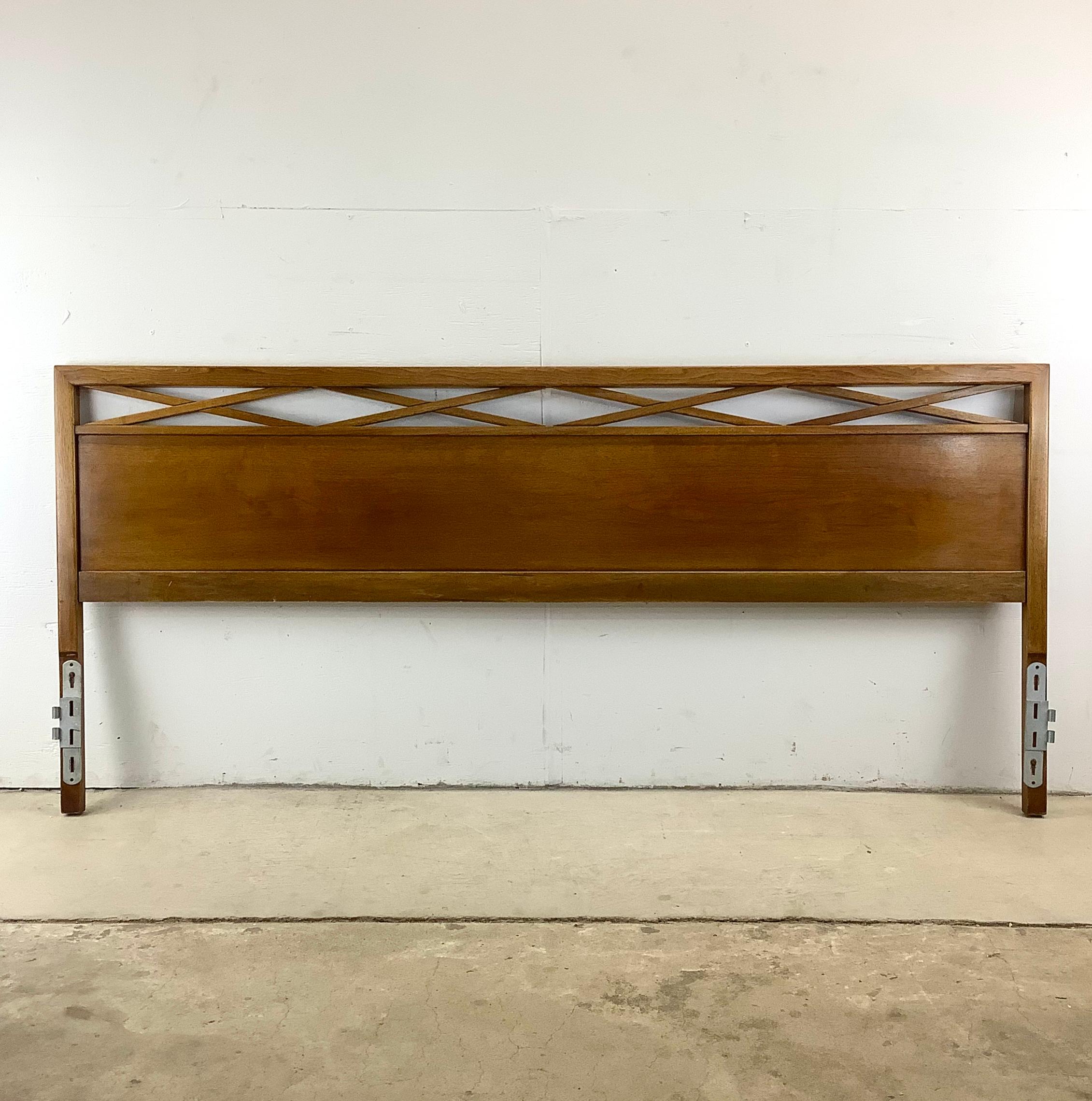 Immerse yourself in the timeless allure of mid-century modern design with this stunning John Widdicomb king size headboard. This exquisite piece is more than just a bedroom centerpiece; it's a testament to the enduring allure of mid-century modern
