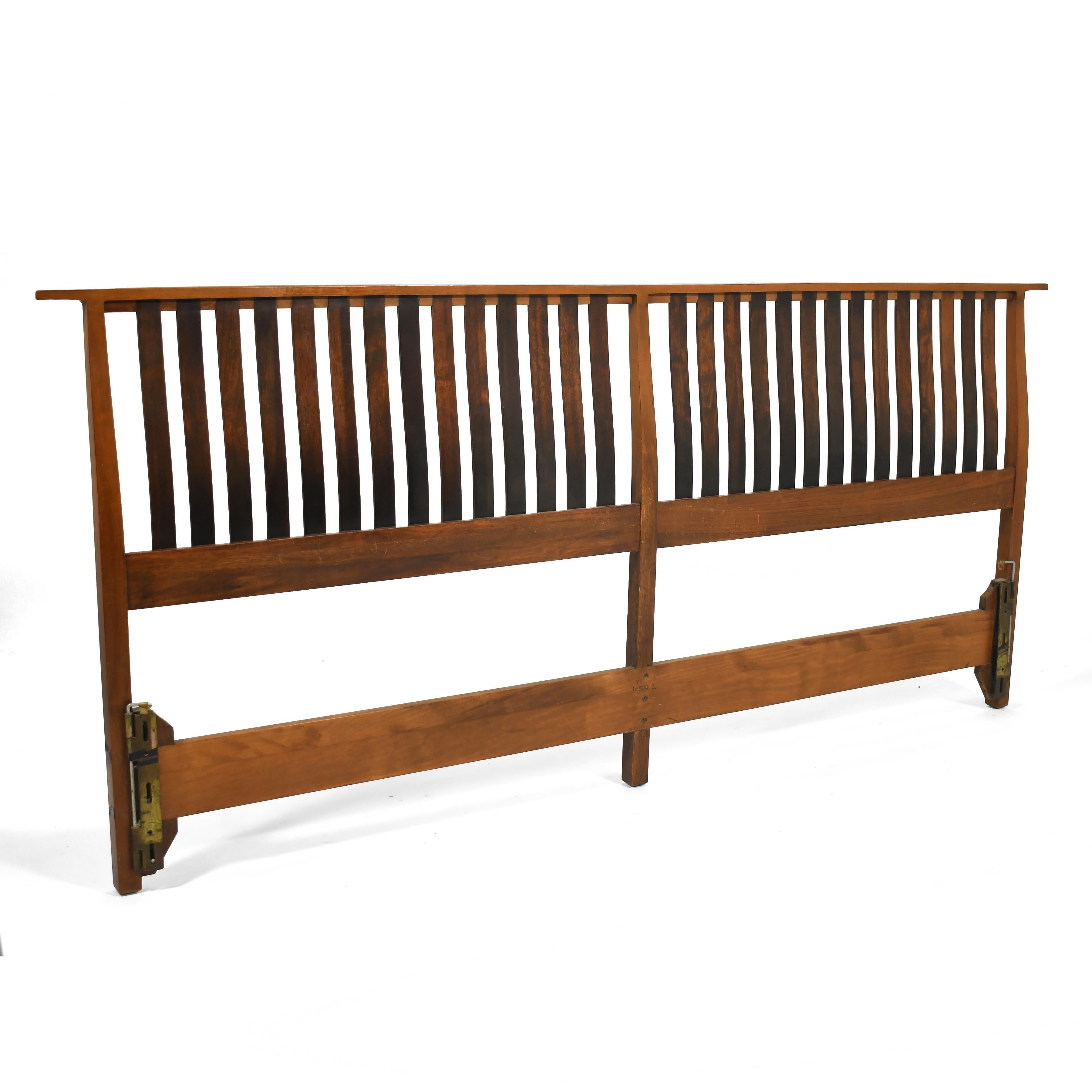 This handsome and beautifully crafted headboard features a beautifully sculpted frame with dark wood slats set with through-tennon joinery.

38