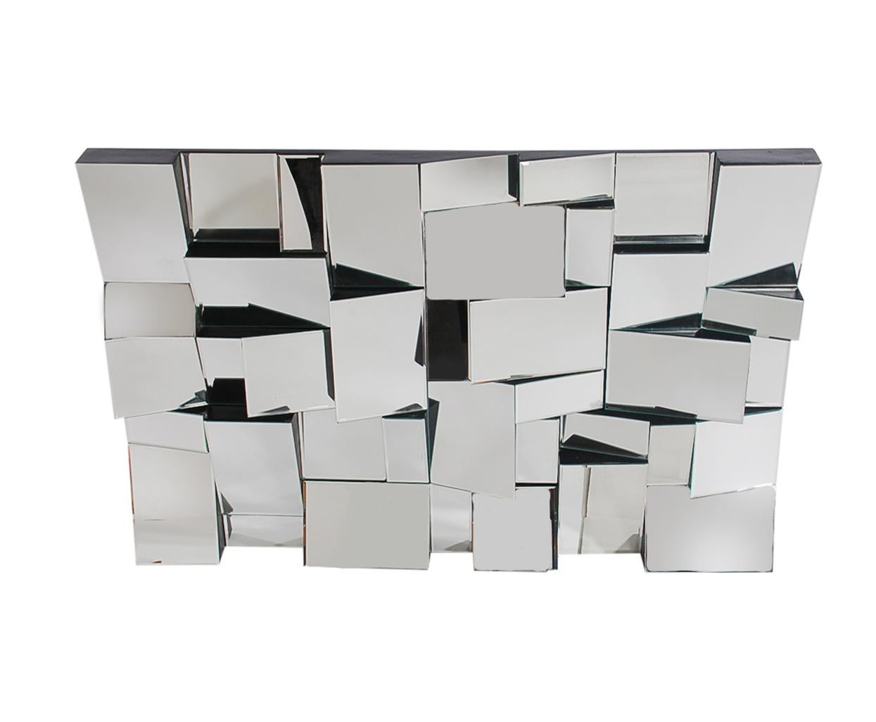 A large and impressive wall mirror designed by Neal Small and produced in the 1970s. It features solid wood construction, black edge frame, and several individual mirrors at different angles. A true focal point of any room.
  
