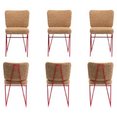 Chaises de salle à manger sculpturales du milieu du siècle en fer émaillé rouge et bouclé en latte, c. 1950.