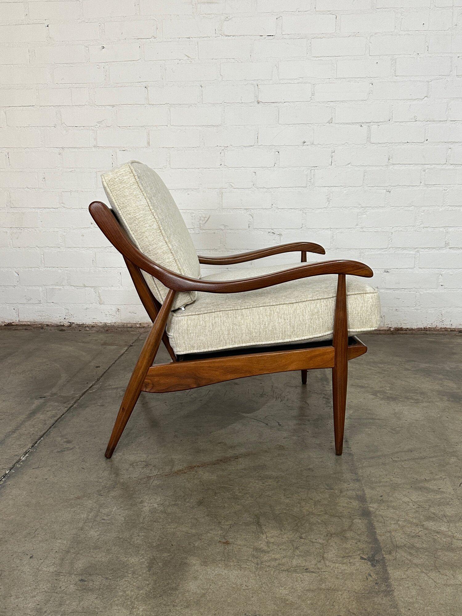 W26 D30 H30 SW22 SD19 SH19 AH21

Circa 1950s solid wood lounge chair restored using walnut brown stain to even the tone throughout and a glossy sealer. The seats have been redone is a woven cream and sand fabric. The seats are comfortable and firm