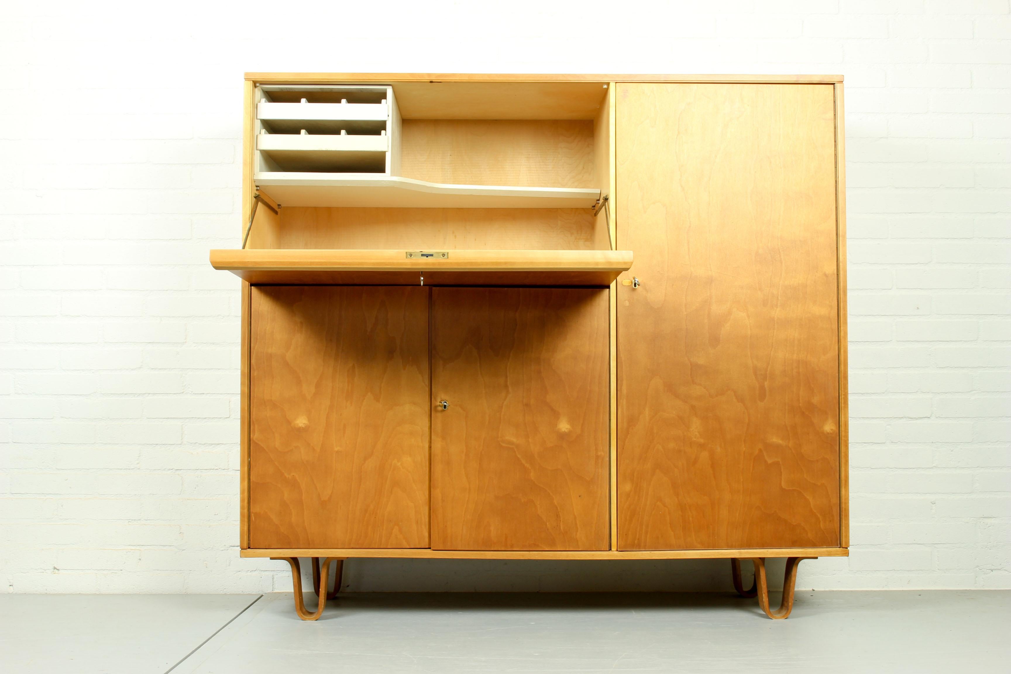 Birch series cabinet by Cees Braakman for Pastoe, type CB-01. Working desk behind the flap door. Flap door has a Formica top on the inside with room for storage of stationary, with two smaller drawers. Typical Braakman 'dust free' drawers and bent