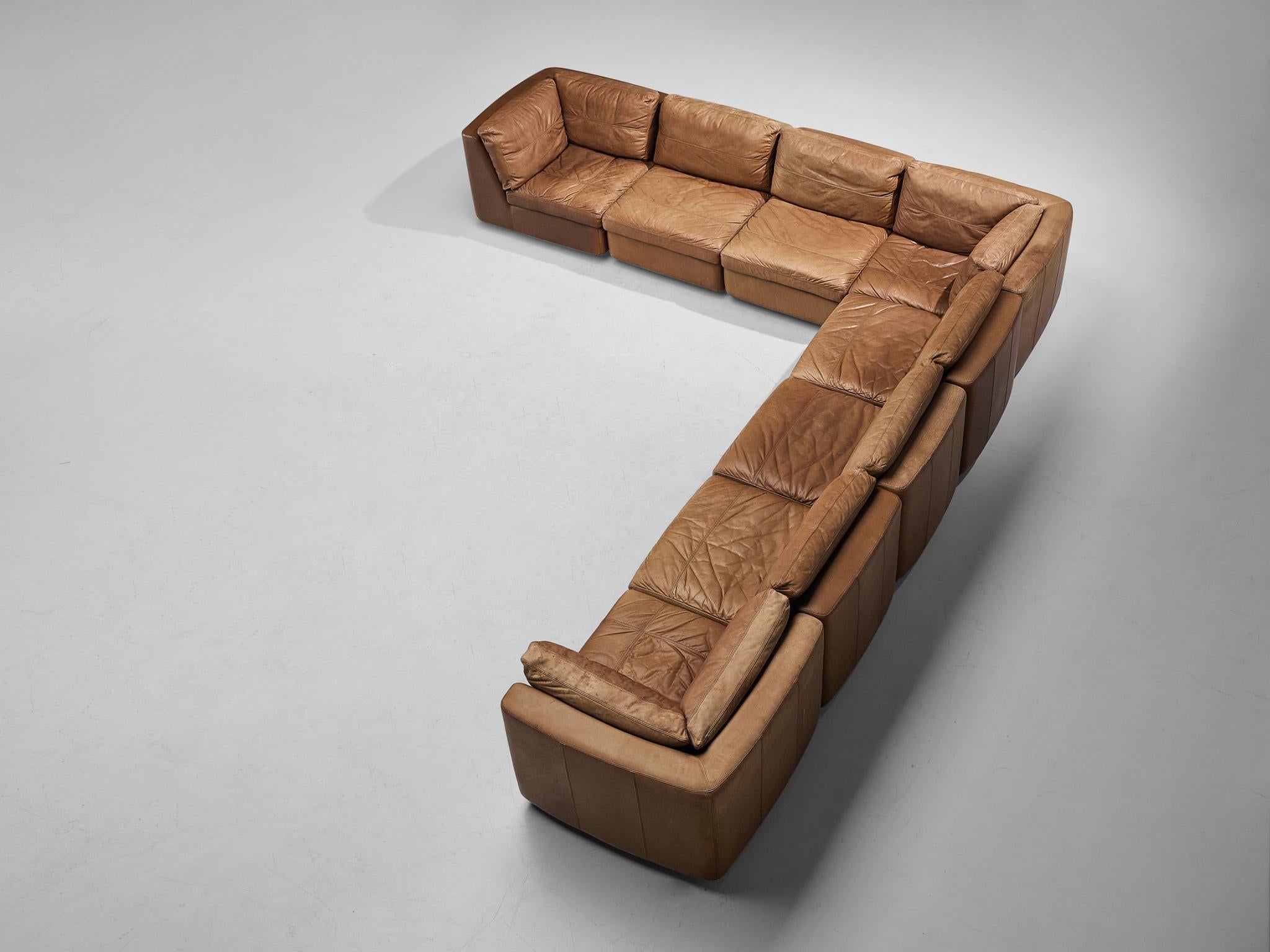 Modular sofa, leather, Germany, 1970s.

This well-designed sofa is fully executed in beautiful cognac leather with age-appropriate, admirable patina that gives this piece of furniture a strong and naturalistic character. This sofa is characterized