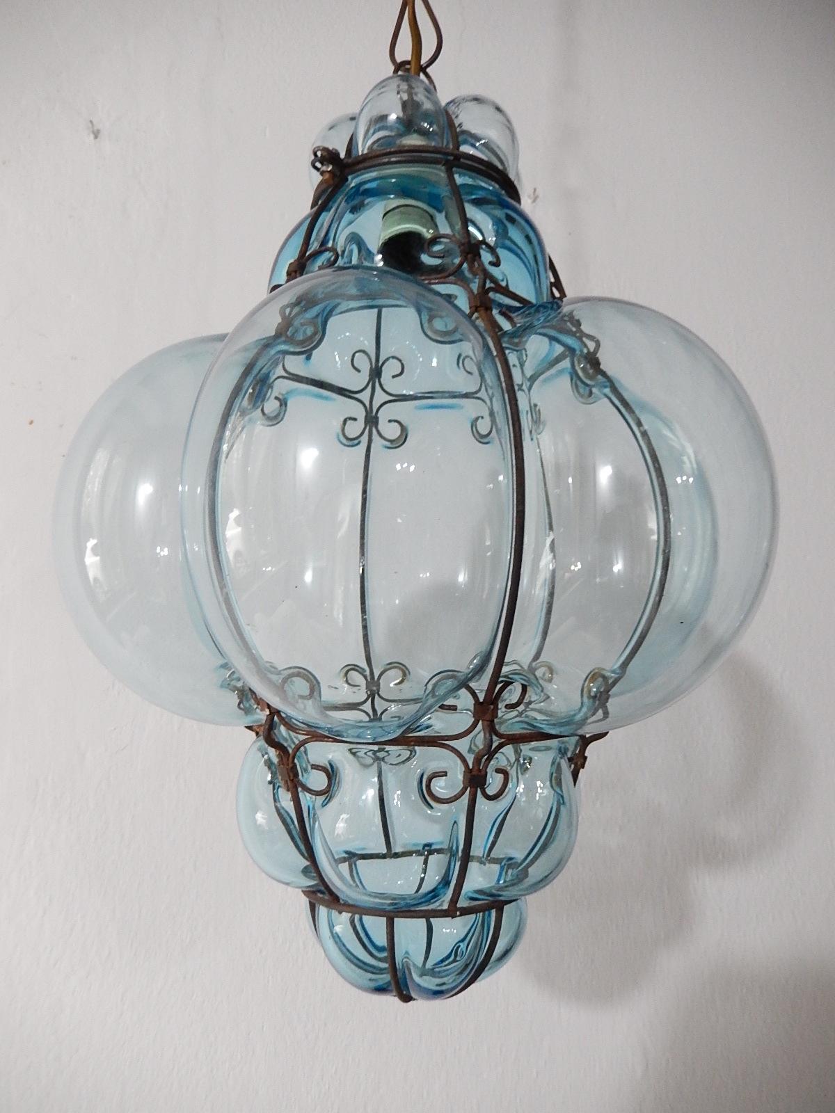 Housing one light. Rare aqua Murano blown glass. Great craftsmanship. Re-wired and ready to hang. Free priority shipping from Italy. Adding another 20 inches (can be shortened) of original chain and canopy.