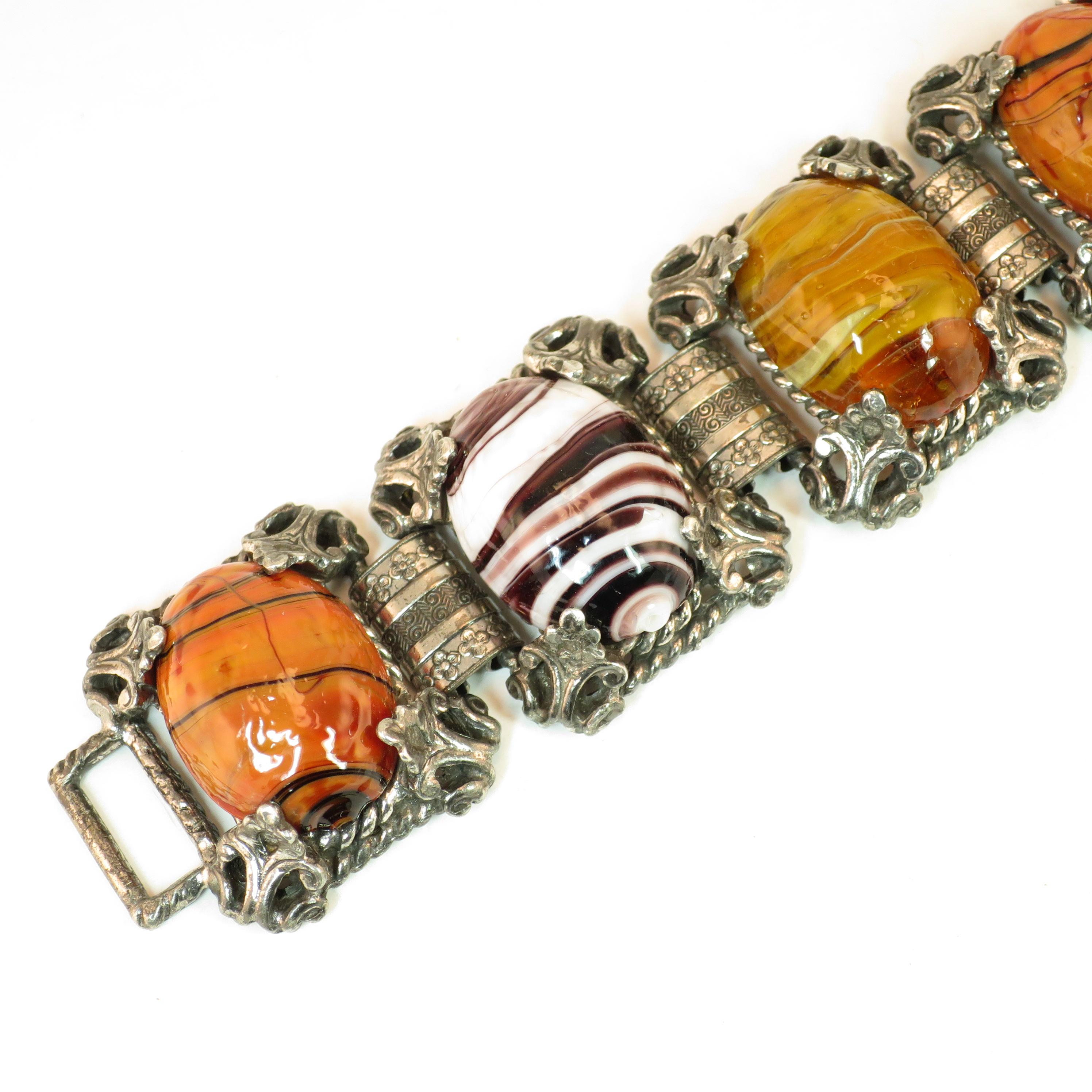 Offered here is a Mid-Century Selro Corp. silver-plated Florentine-design link bracelet from the 1950s. The construction exhibits six platforms linked by wide connectors. Each platform consists of a open rectangle in a twisted rope motif, and within