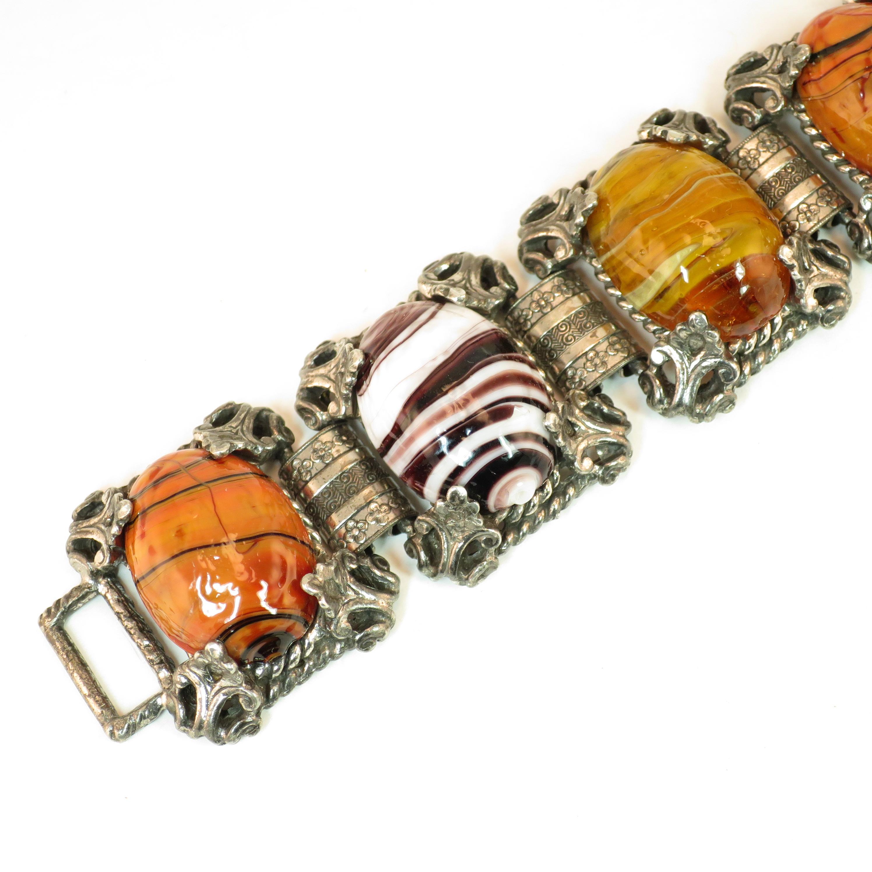 Offered here is a Mid-Century Selro Corp. silver-plated Florentine-design link bracelet from the 1950s. The construction exhibits six platforms linked by wide connectors. Each platform consists of a open rectangle in a twisted rope motif, and within