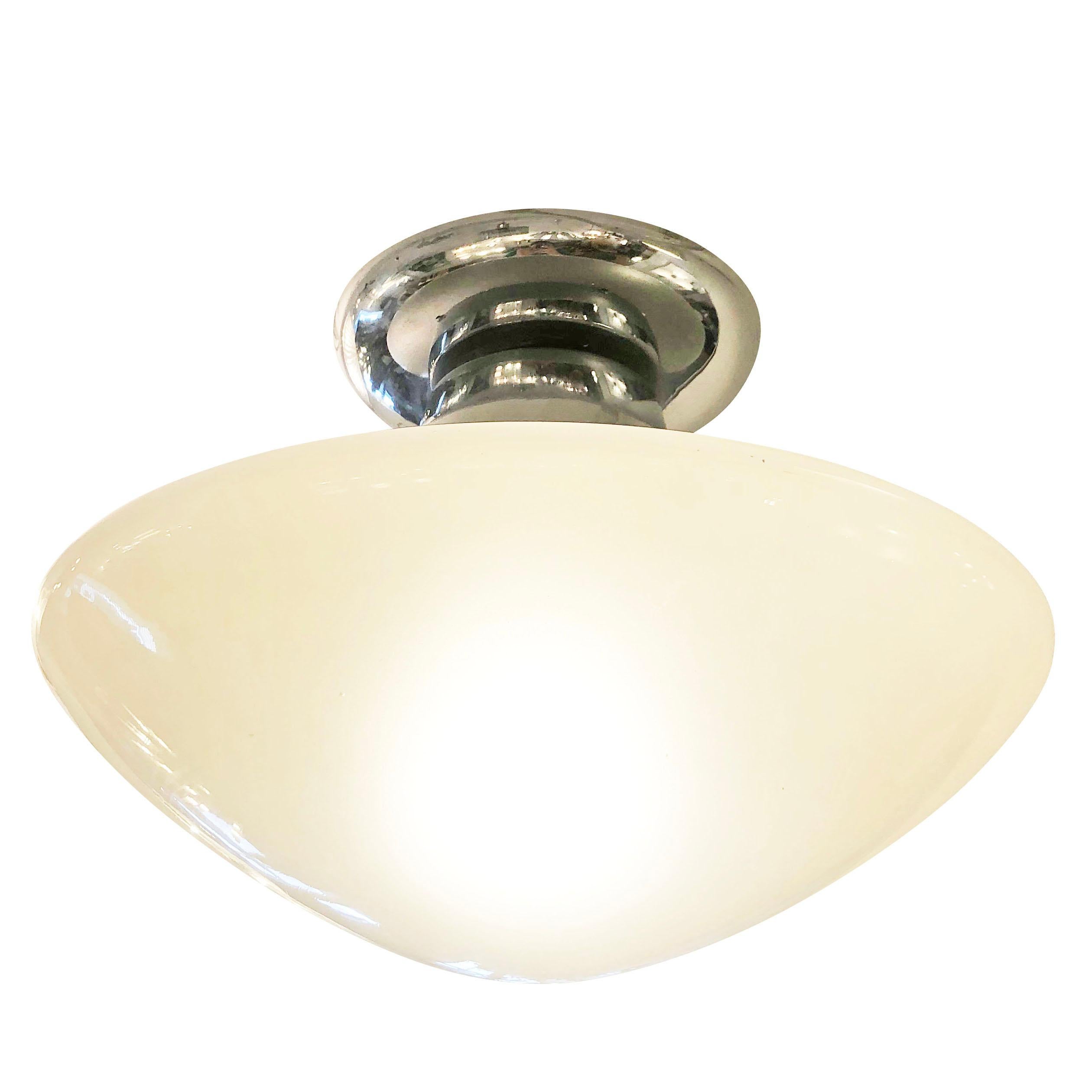 Italian midcentury semi-flushmount by Greco with an opaline glass shade and chrome frame. Holds one E26 socket. Two available

Condition: Excellent vintage condition, minor wear consistent with age an use

Measures: Diameter 15”

Height